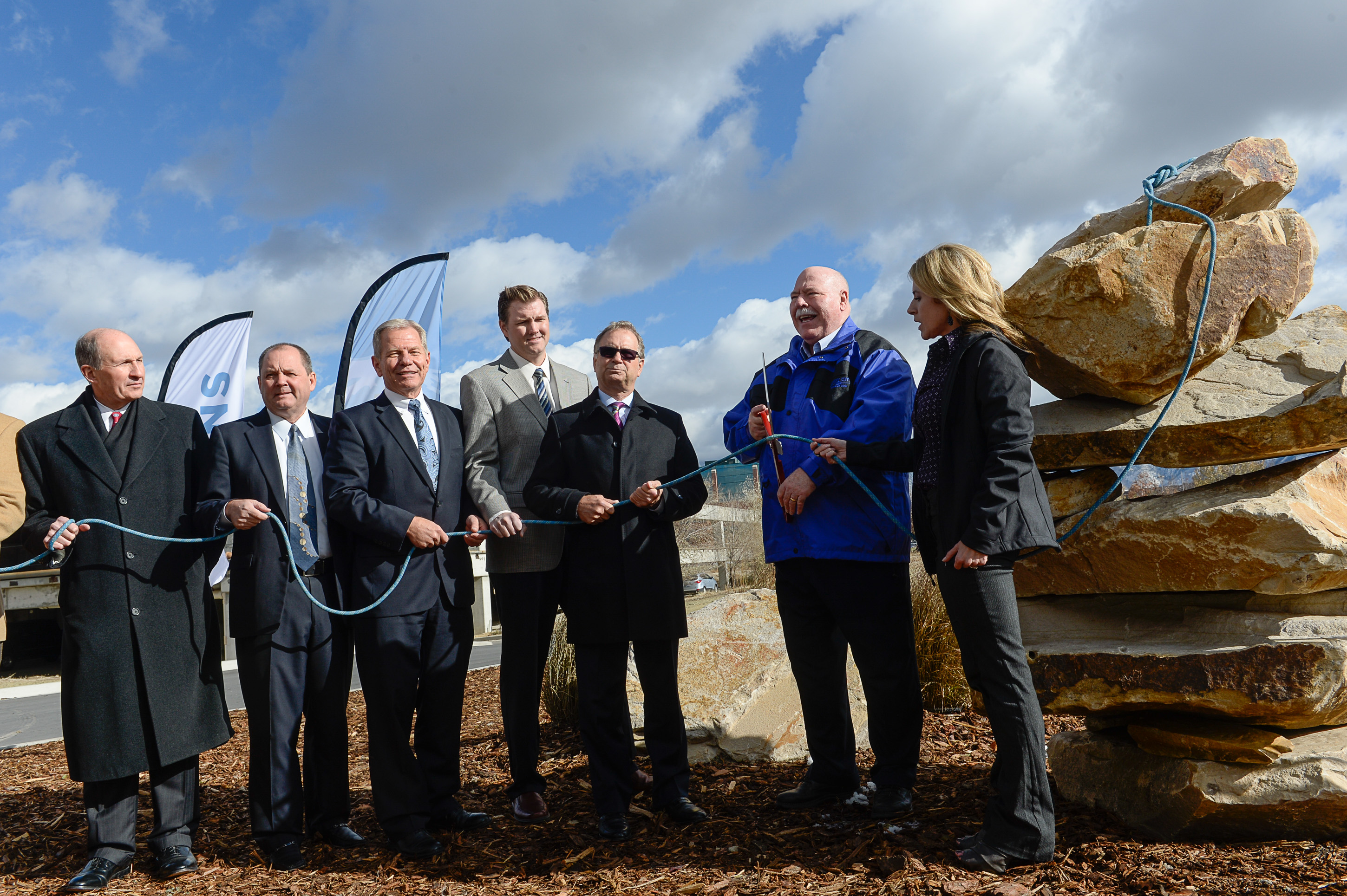 Francisco Kjolseth | The Salt Lake Tribune
Sandy officials, including Mayor Tom Dolan, second from right, hold a "climbing rope" cutting event at the site of the future Prestige, a 25-story high-rise residential building in the heart of a new 1,100 acre city center called "The Cairns." The project from 90th S. to 114th S., and I-15 to UTA light rail calls for 20 million square feet of development.