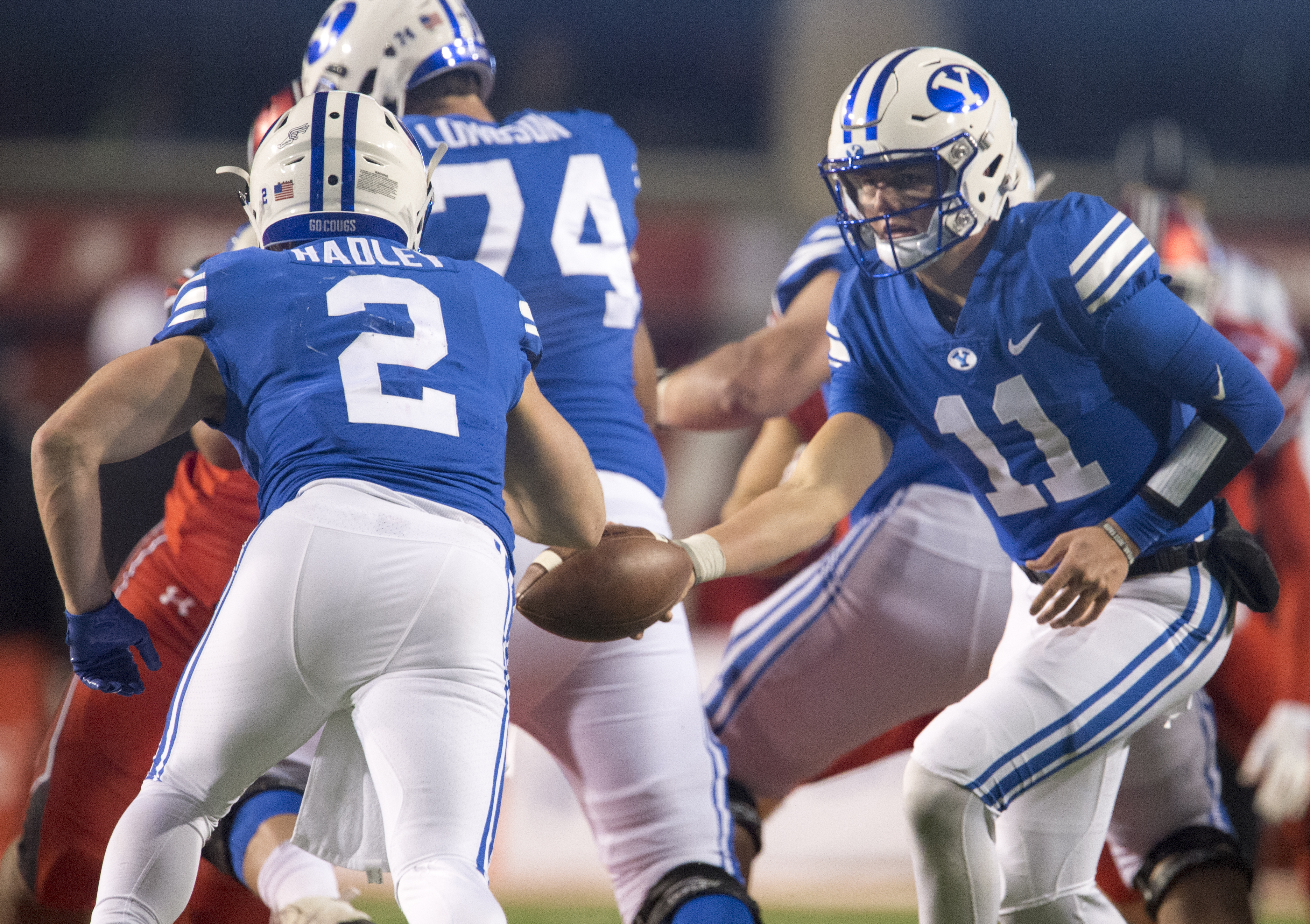 (Rick Egan | The Salt Lake Tribune) Brigham Young Cougars quarterback Zach Wilson (11 hands off to Brigham Young Cougars running back Matt Hadley (2), in football action between the Brigham Young Cougars and the Utah Utes, at Rice-Eccles Stadium, Saturday, November 24, 2018. 