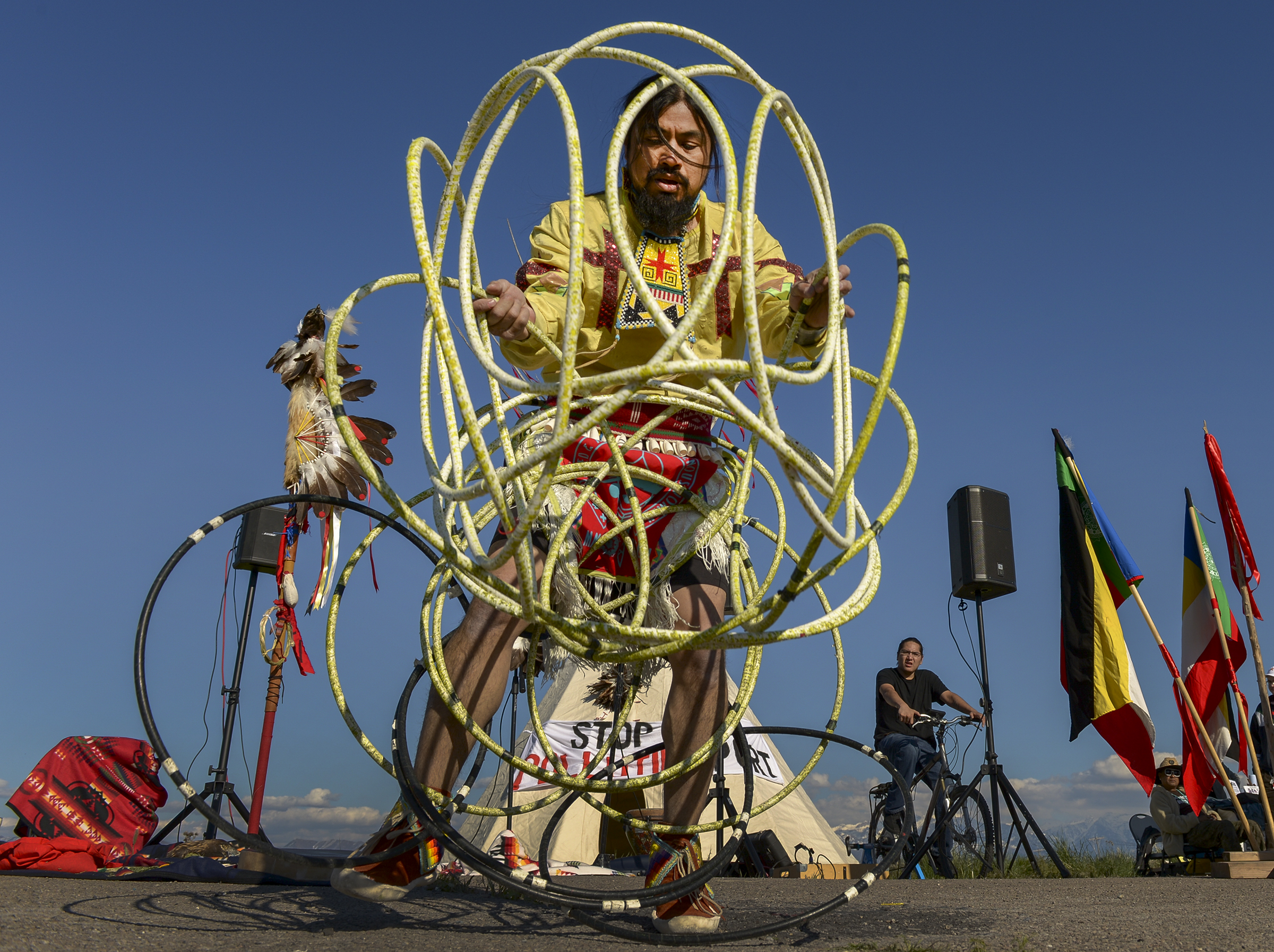 Leah Hogsten | The Salt Lake Tribune Carl Moore, a Hopi and Chemehuevi Native American performs a hoop dance in honor of Mother Earth. Moore also made offerings, sang and gave a prayer during the May Day celebration. The "Stop the Polluting Port" community coalition staged a May Day celebration, calling for respect and awareness of the water, earth and air regarding the 20,000 acres west of Salt Lake City where the inland port industrial site has been proposed.