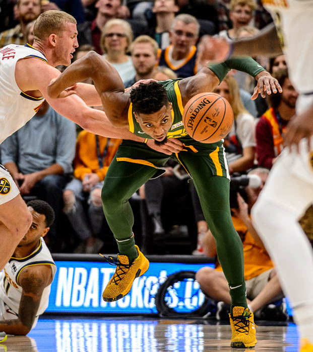 (Trent Nelson | The Salt Lake Tribune) Utah Jazz guard Donovan Mitchell (45) chases down a loose ball as the Utah Jazz host the Denver Nuggets, NBA basketball in Salt Lake City on Wednesday Jan. 23, 2019.