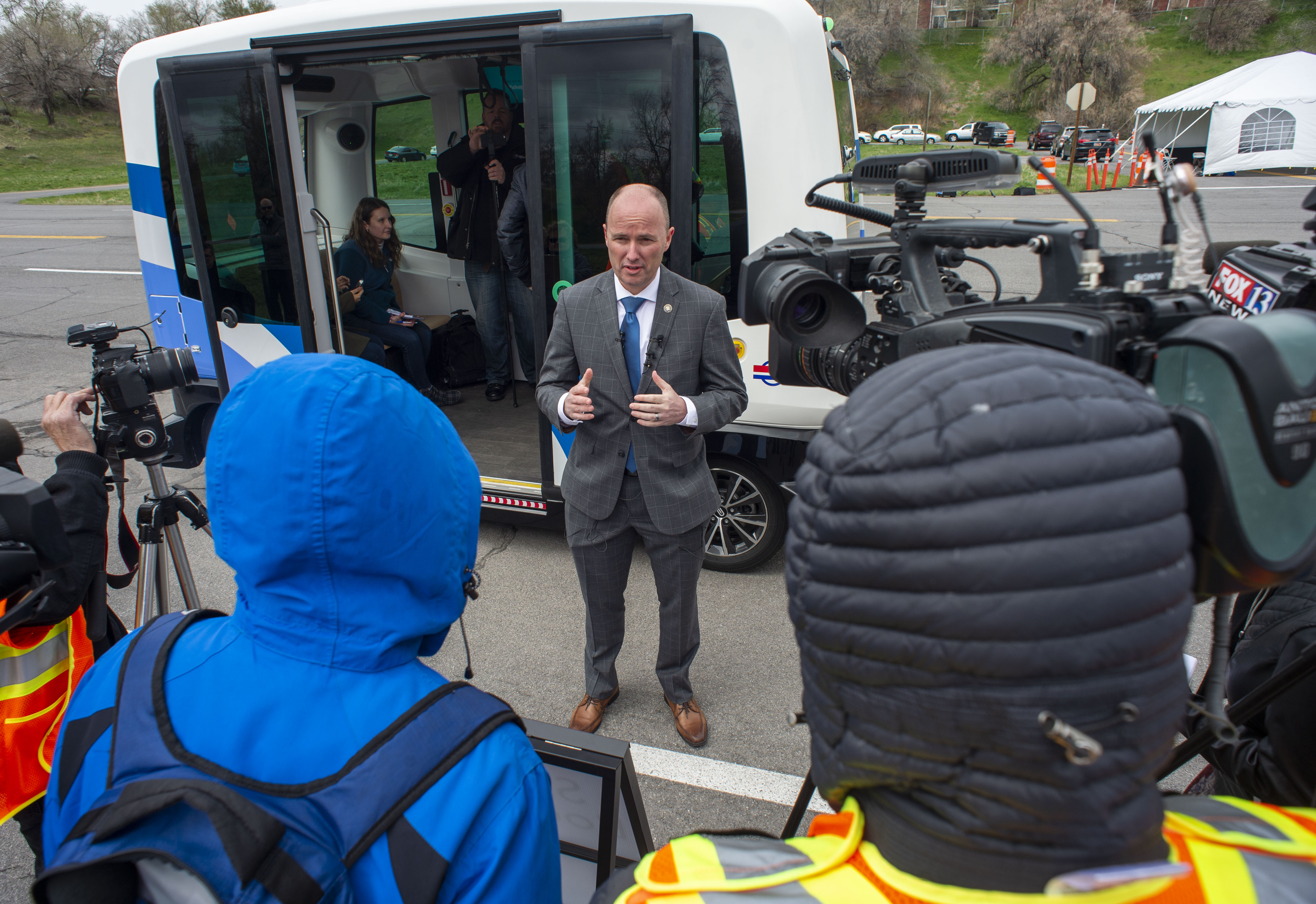 (Rick Egan | The Salt Lake Tribune) Lt. Governor Spencer J. Cox talks to the media after his ride in the Autonomous Shuttle, at the test track is across the street from UDOT headquarters on the west side of 2700 West. Thursday, April 11, 2019. 