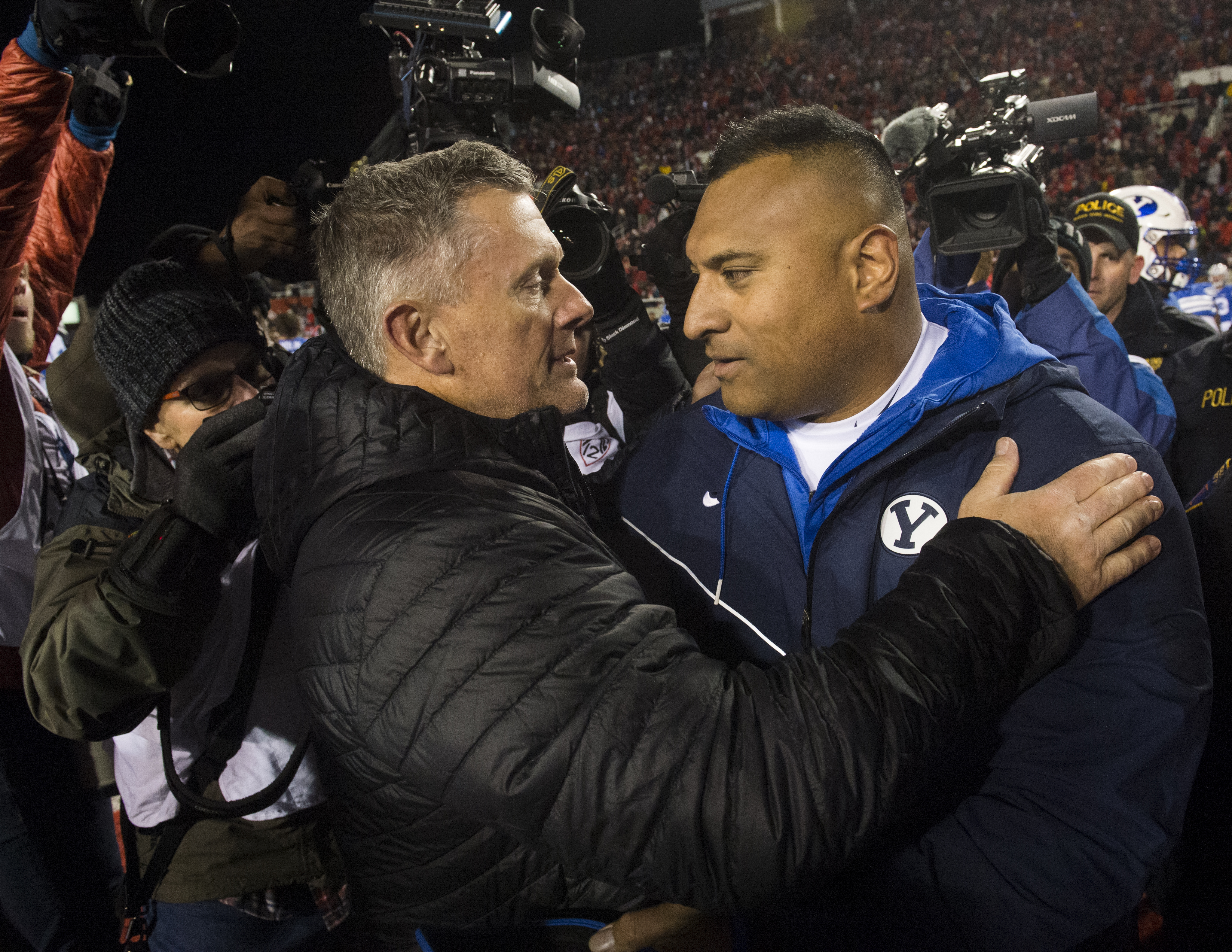 (Rick Egan | The Salt Lake Tribune) Utah Utes head coach Kyle Whittingham greets Brigham Young Cougars head coach Kalani Sitake after Utah defeated BYU, 35-27, in football action between the Brigham Young Cougars and the Utah Utes, at Rice-Eccles Stadium, Saturday, November 24, 2018. 