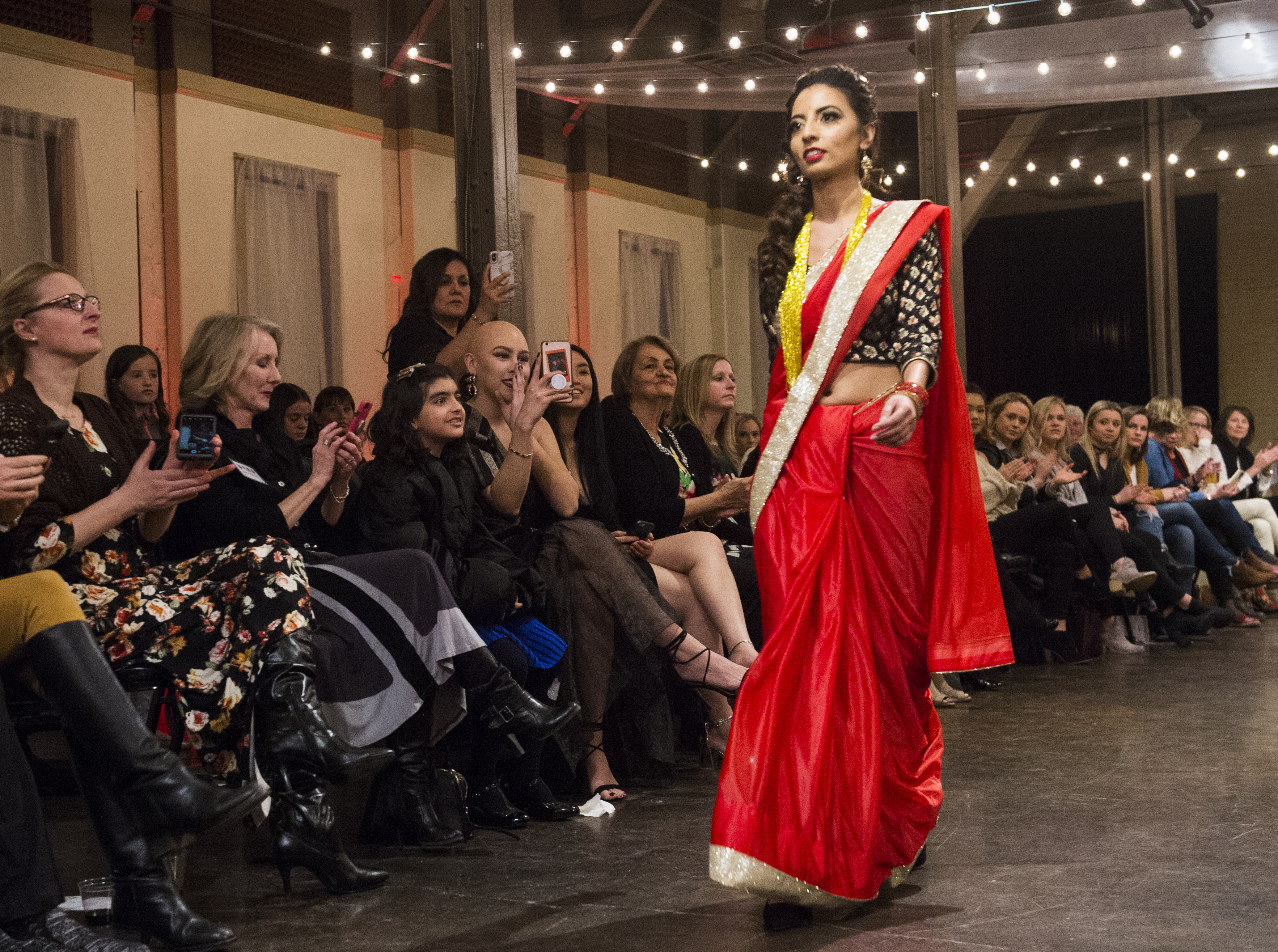 (Rick Egan | The Salt Lake Tribune) Aarati Ghimire from Nepal, walks the runway at the 8th Annual Women of the World Fashion Show. The fashion show fund is raiser for the non-profit that seeks to help refugees settle in a new culture. Wednesday, March 7, 2018. 