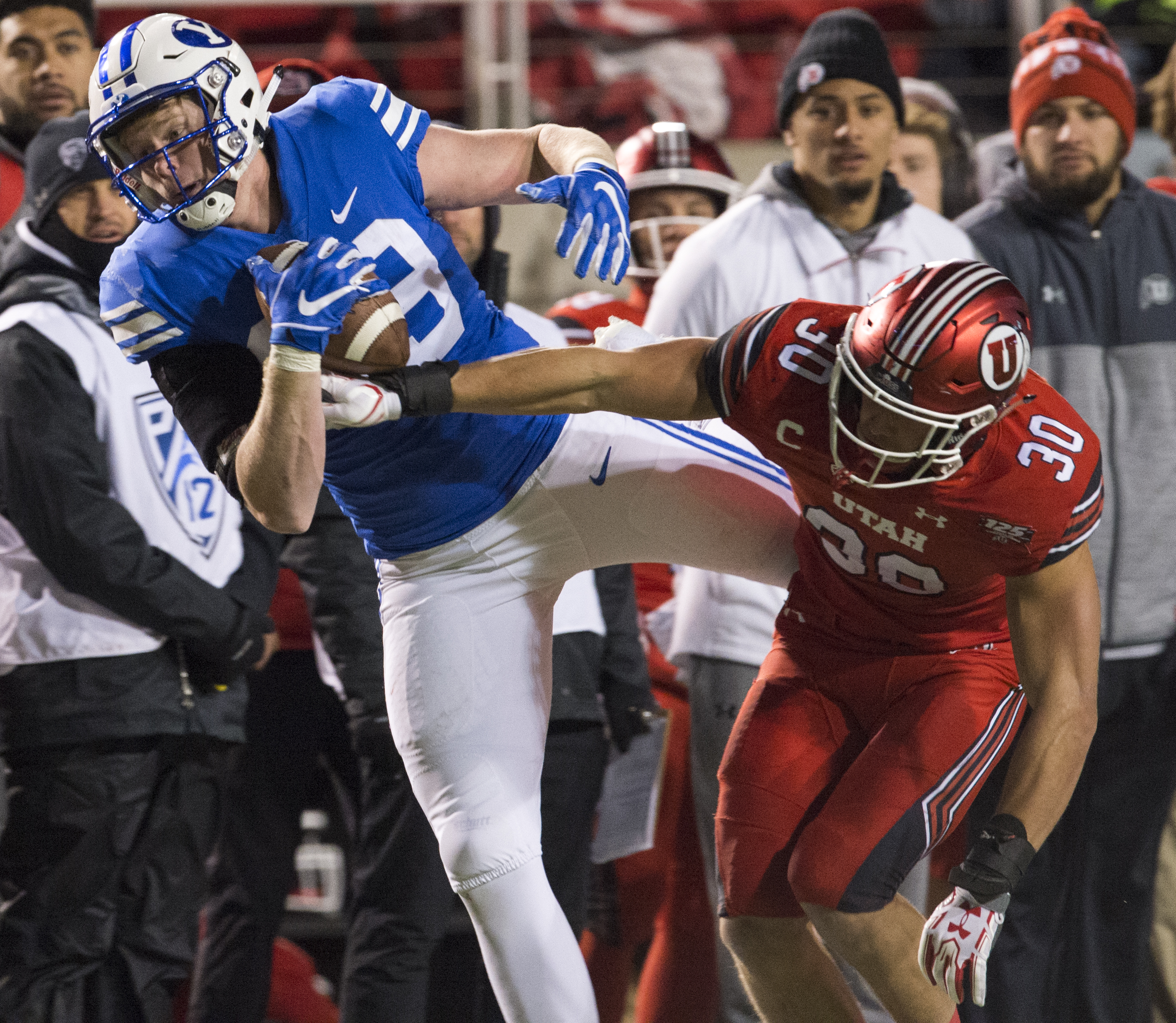 (Rick Egan | The Salt Lake Tribune) Brigham Young Cougars tight end Matt Bushman (89) grabs a one handed pass, as Utah Utes linebacker Cody Barton (30) defends, in football action between the Brigham Young Cougars and the Utah Utes, at Rice-Eccles Stadium, Saturday, November 24, 2018. 