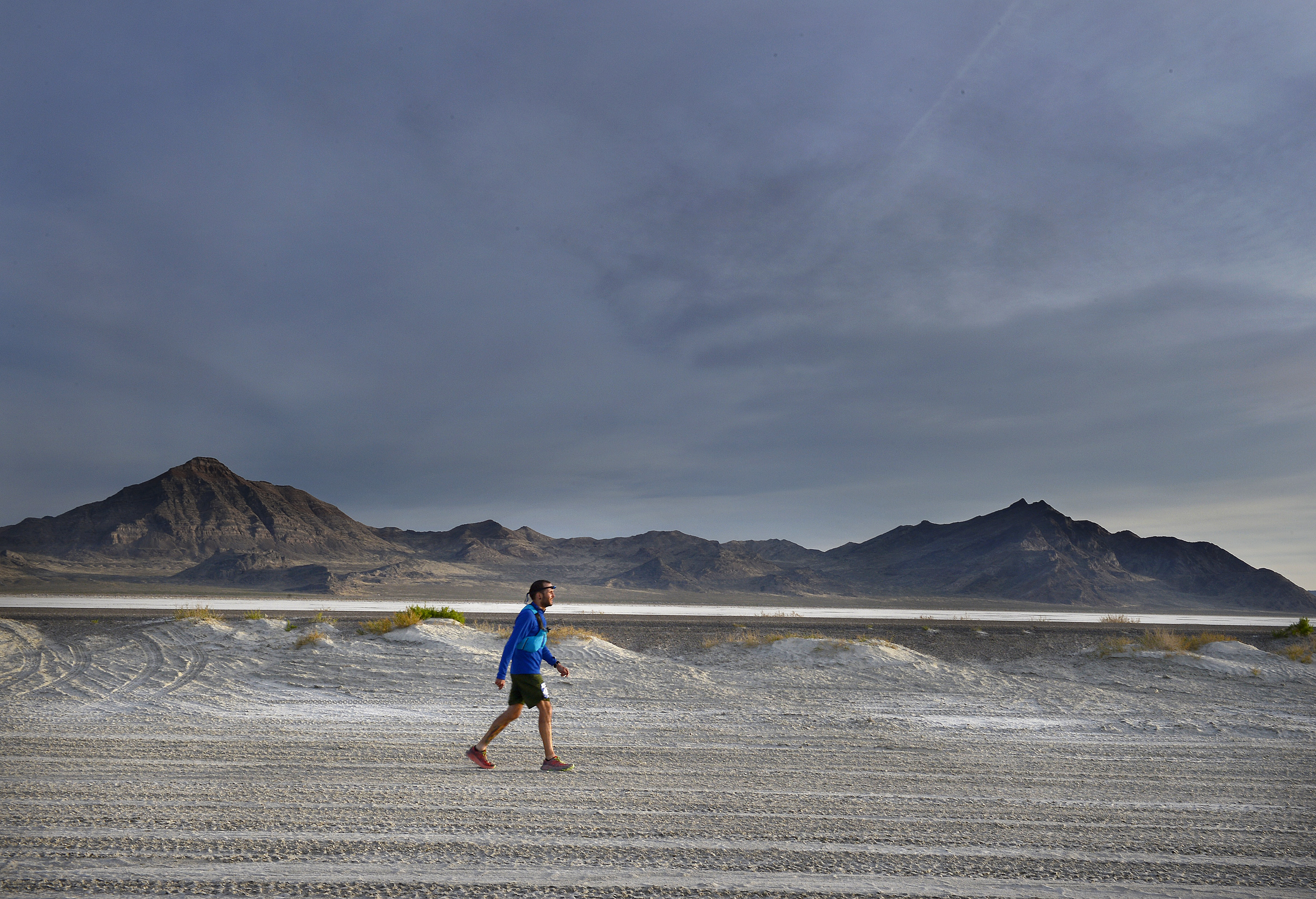 (Scott Sommerdorf | The Salt Lake Tribune) Alex Doolan walks the last mile of the Salt Flats 100 Endurance Run, Saturday, May 5, 2018. 