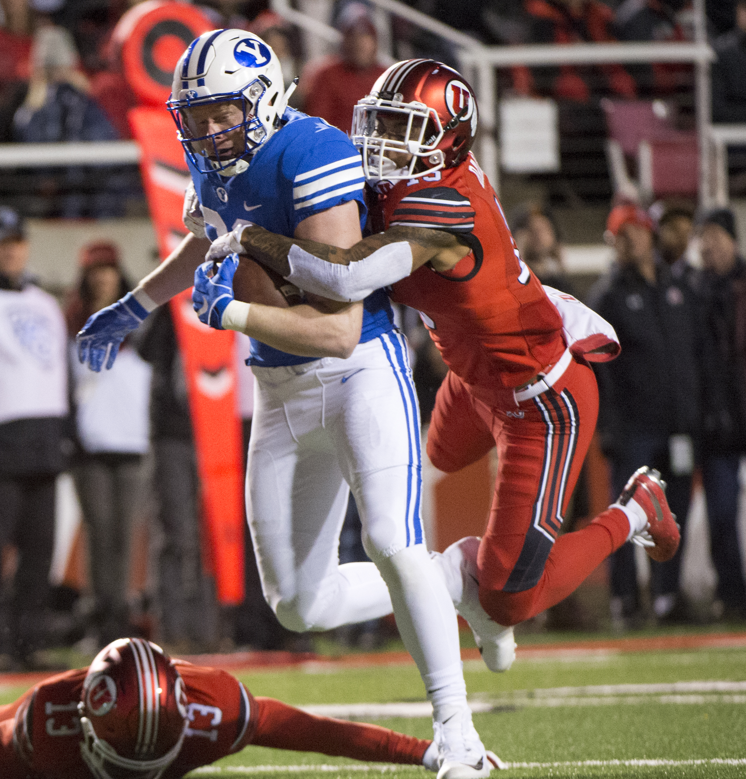 (Rick Egan | The Salt Lake Tribune) Brigham Young Cougars tight end Matt Bushman (89) gets past Utah Utes defensive back Marquise Blair (13) and Utah Utes defensive back Corrion Ballard (15) to score a touchdown for the Cougars, in football action between the Brigham Young Cougars and the Utah Utes, at Rice-Eccles Stadium, Saturday, November 24, 2018. 