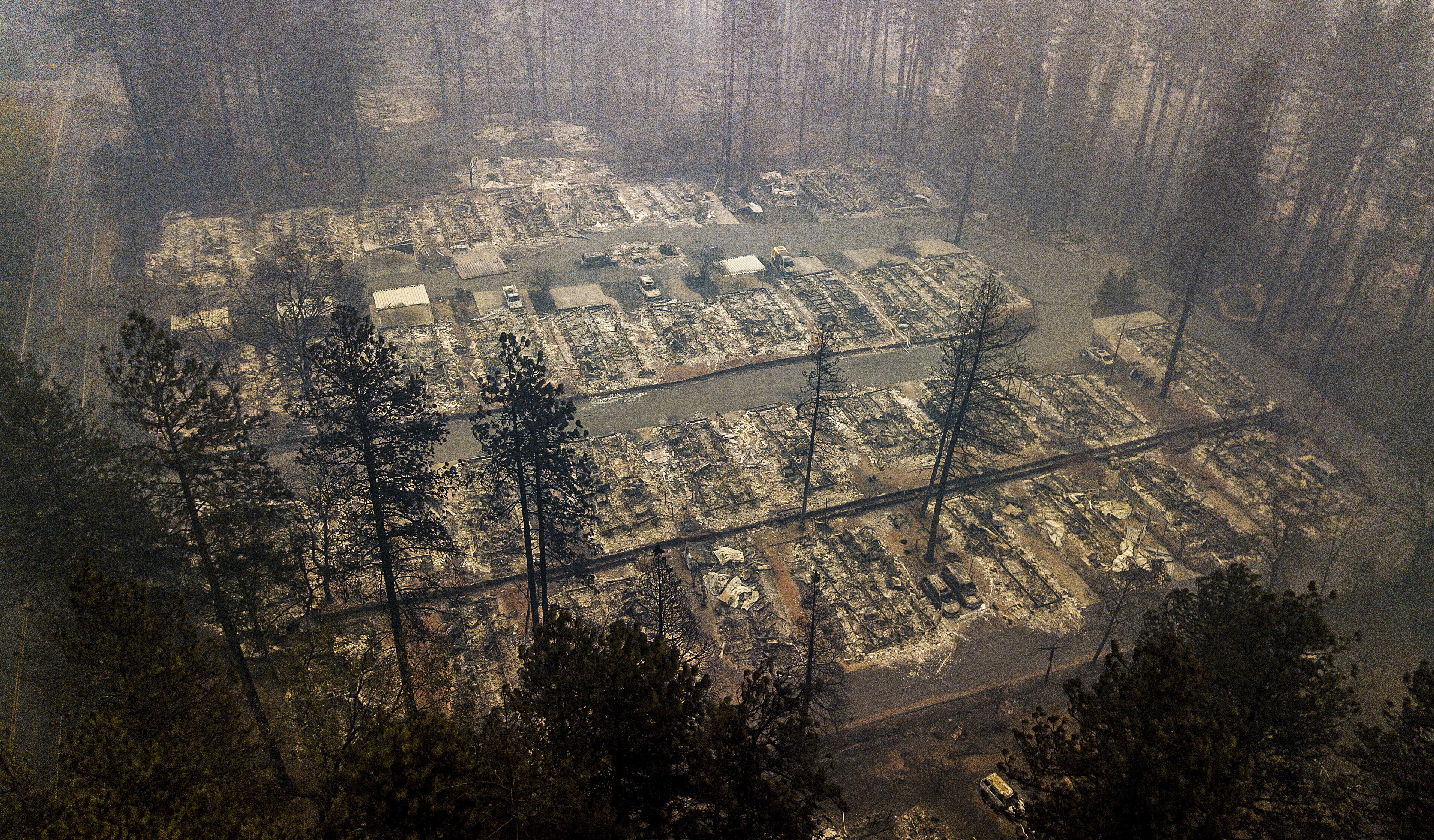 Residences leveled by the wildfire line a neighborhood in Paradise, Calif., on Thursday, Nov. 15, 2018. The California Department of Forestry and Fire Protection said Thursday the wildfire that destroyed the town of Paradise is now 40 percent contained, up from 30 percent Wednesday morning. (AP Photo/Noah Berger)