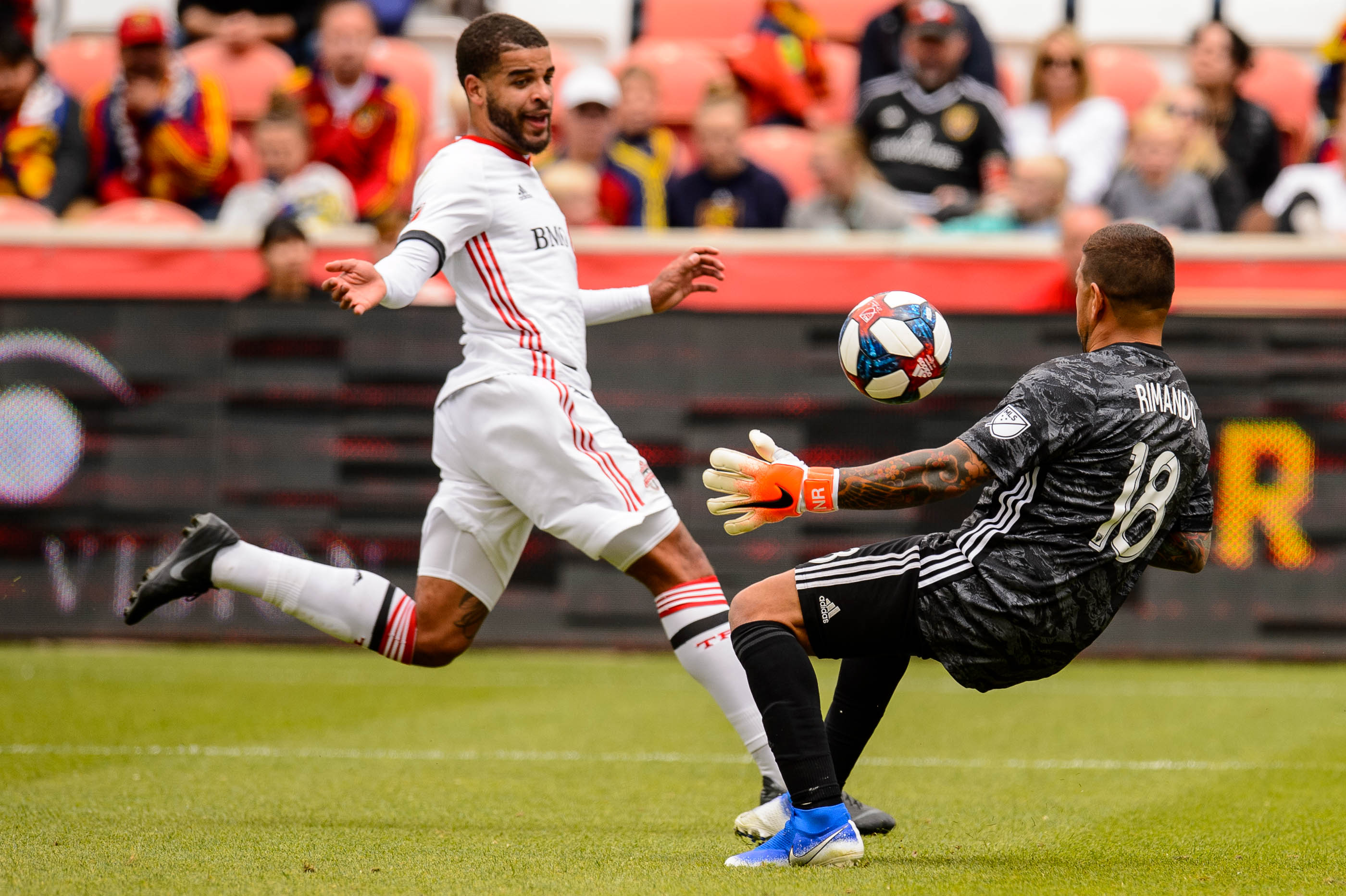 (Trent Nelson | The Salt Lake Tribune) Real Salt Lake goalkeeper Nick Rimando (18) makes a save as Real Salt Lake hosts Toronto FC, MLS Soccer at Rio Tinto Stadium in Sandy on Saturday May 18, 2019. Toronto FC forward Jordan Hamilton (7) at left.