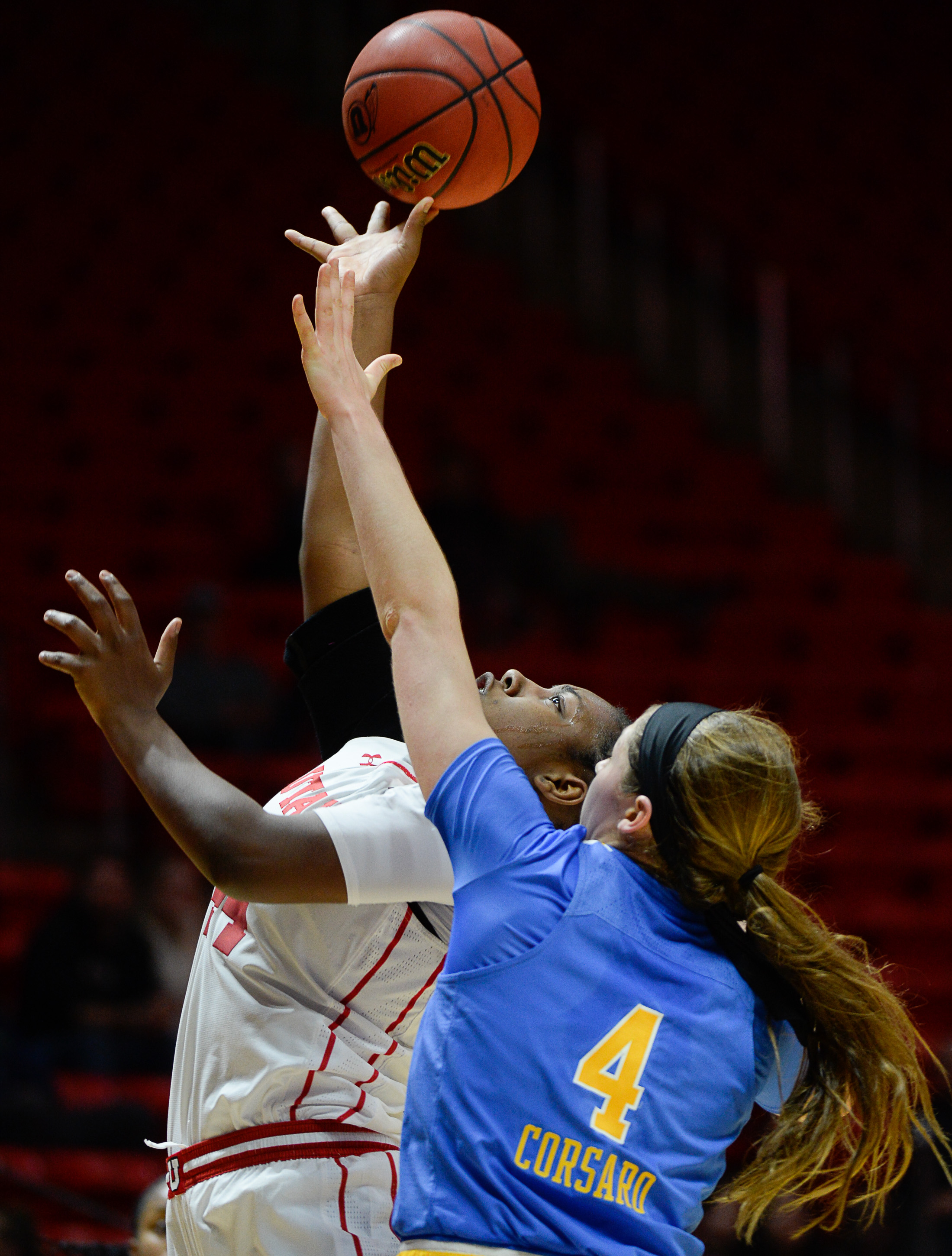 (Francisco Kjolseth | The Salt Lake Tribune) Utah Utes guard/forward Dre'Una Edwards (44) lays one up over UCLA Bruins guard Lindsey Corsaro (4) at the Jon M. Huntsman Center in Salt Lake City on Sunday, Feb. 10, 2019.