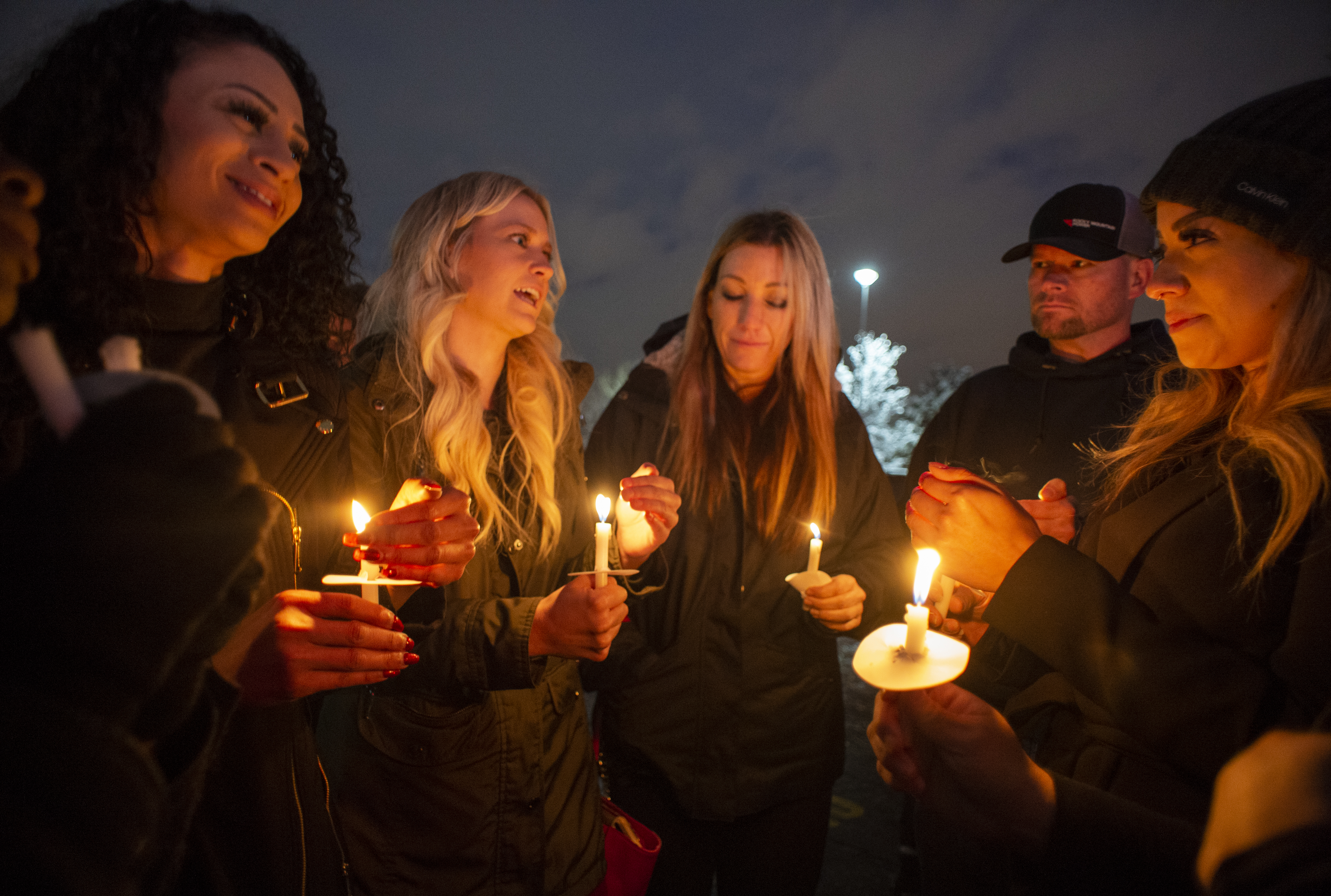 (Rick Egan | The Salt Lake Tribune) People who worked with David Stokoe reminisce about the friend they lost, during a candlelight vigil for David Stokoe, a real estate agent killed at one of his rentals last week. Monday, Jan. 21, 2019.