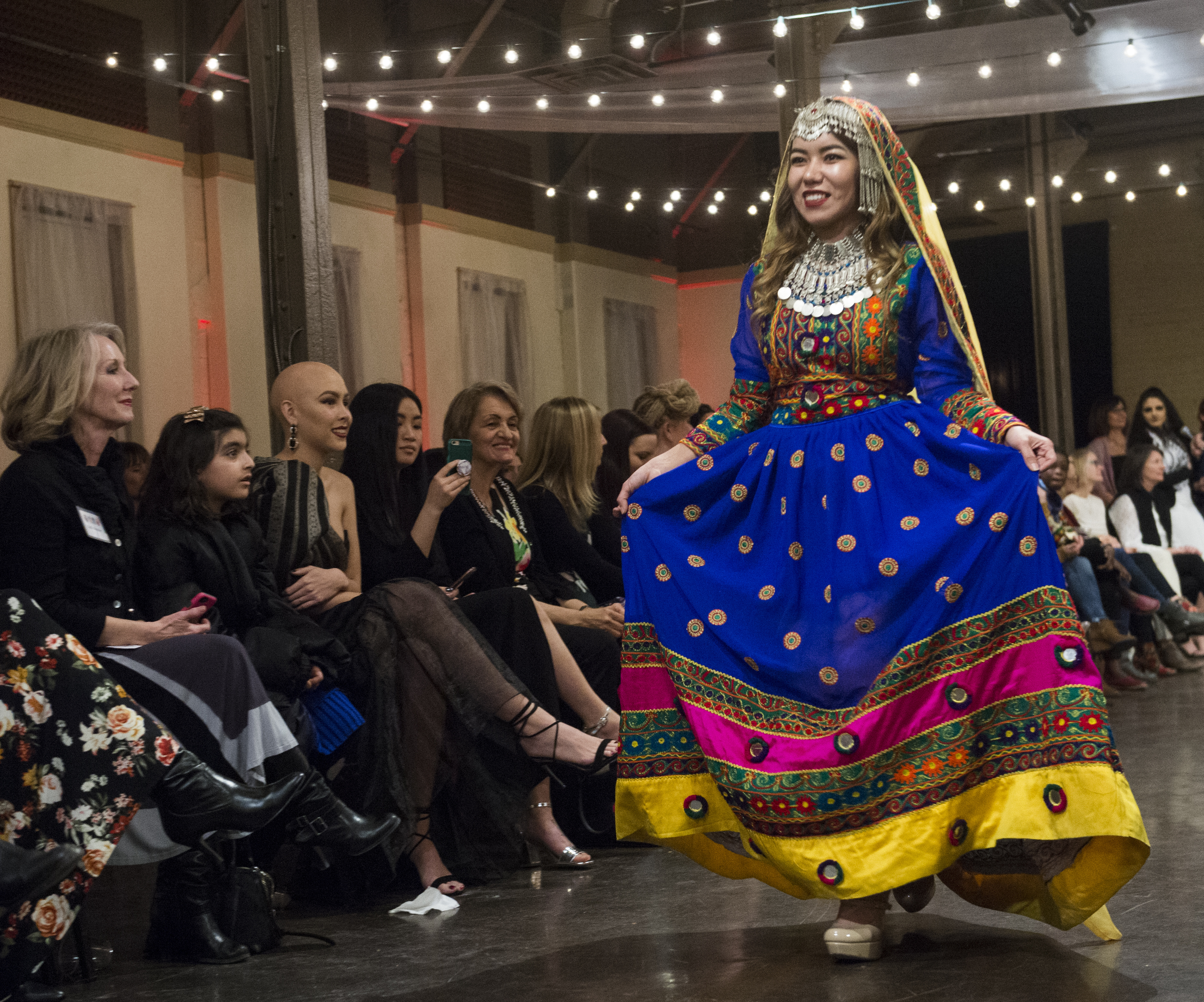 (Rick Egan | The Salt Lake Tribune) Golshan from Afghanistan walks the runway during the 8th Annual Women of the World Fashion Show. The fashion show fund is raiser for the non-profit that seeks to help refugees settle in a new culture. Wednesday, March 7, 2018. 