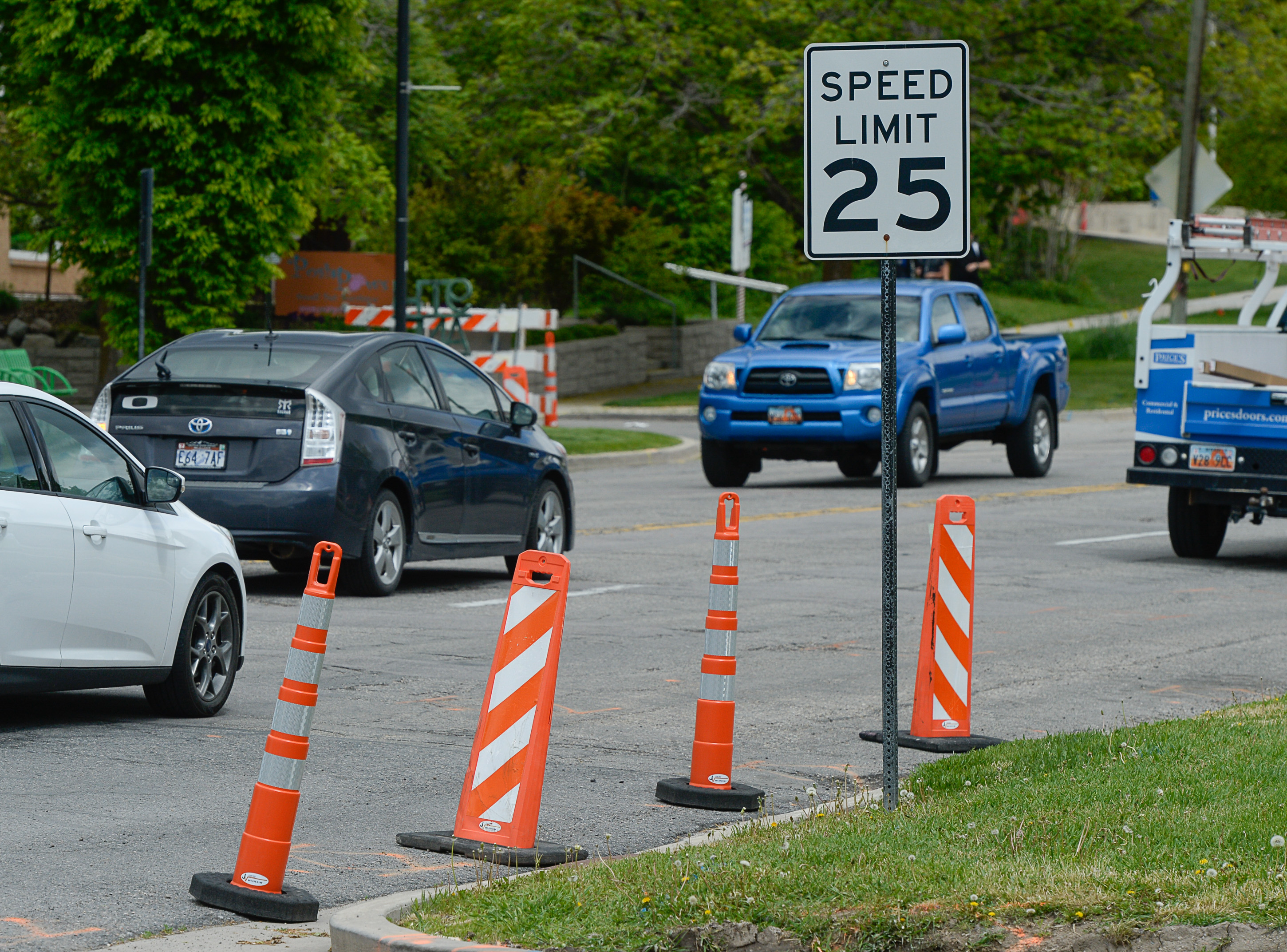 (Francisco Kjolseth | The Salt Lake Tribune) Traffic moves along a sea of orange as plans to repurpose 29 parking spaces between 950 East and 1300 East on 900 South in Salt Lake City causes some frustration from business owners and residents in the area.