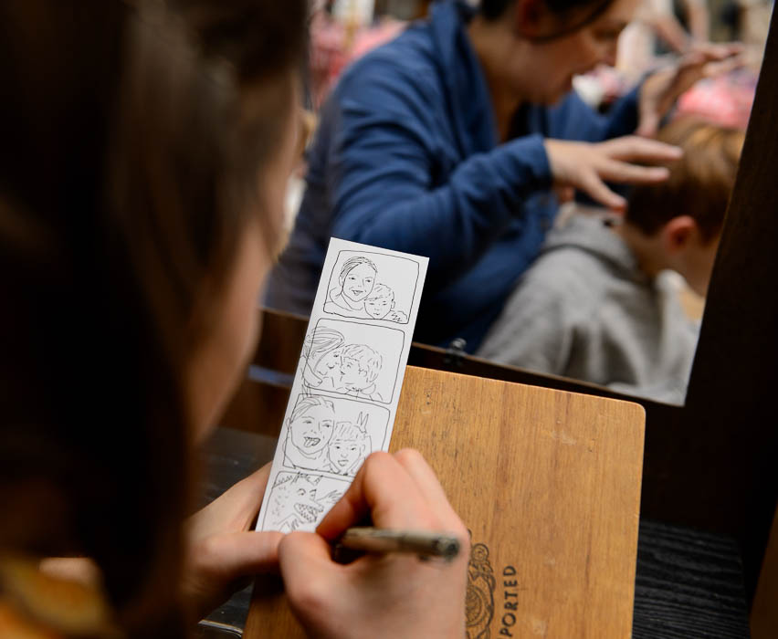(Trent Nelson | The Salt Lake Tribune) Natalie Allsup-Edwards, the artist behind the Hand Drawn Photo Booth, sketches Bella and Dexter Church at the Tumbleweeds Film Festival, Saturday March 3, 2018.