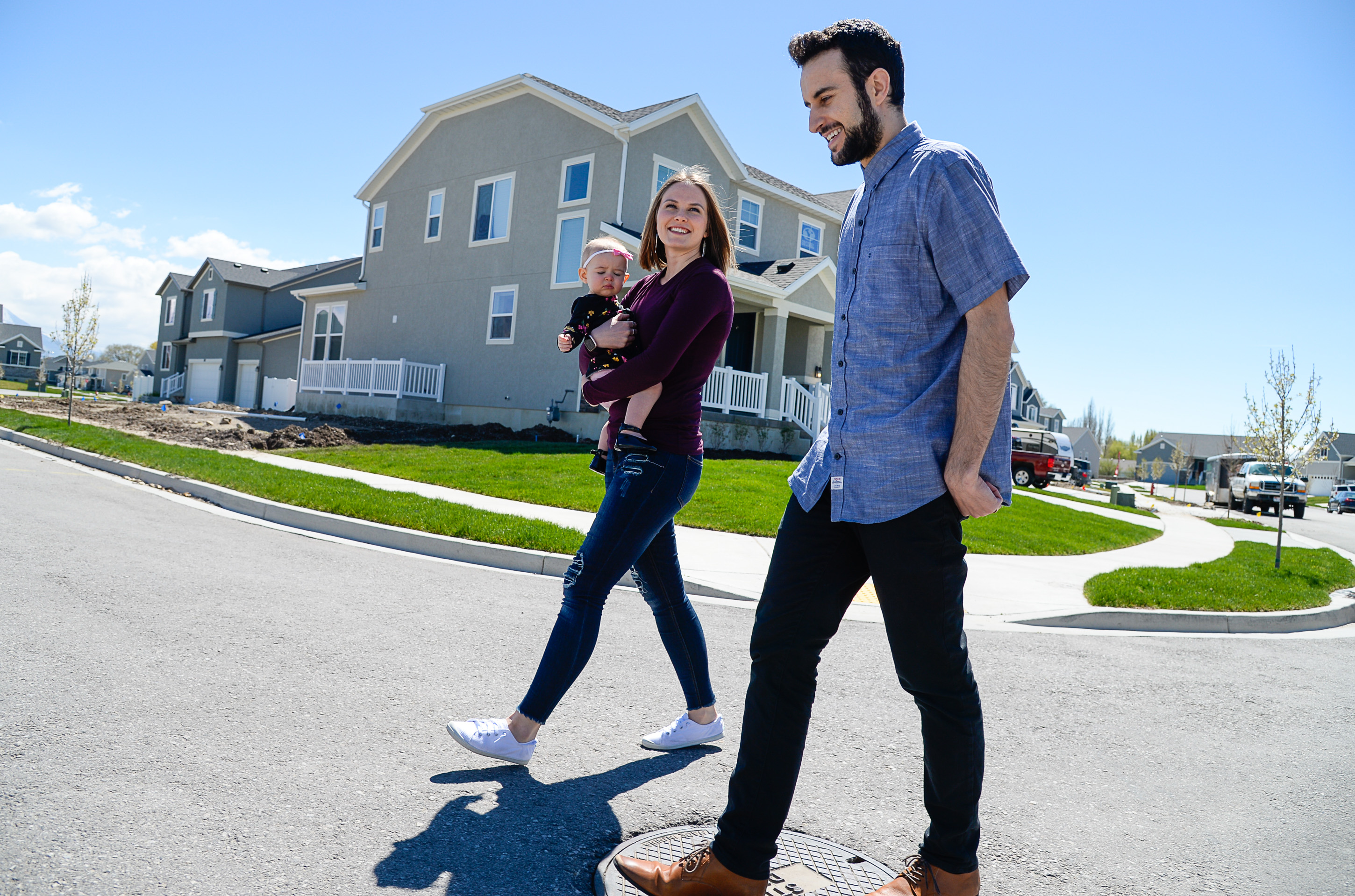 (Francisco Kjolseth | The Salt Lake Tribune) Ember and Jeremy Ulrich take their daughter Jemma, 1, for a walk around their newly developed neighborhood in Lehi after moving there from Pleasant Grove last October. Along with some friends who were also looking to get more house for their money and ended up moving in next door, Jeremy wanted to be closer to his job at Adobe in Lehi.