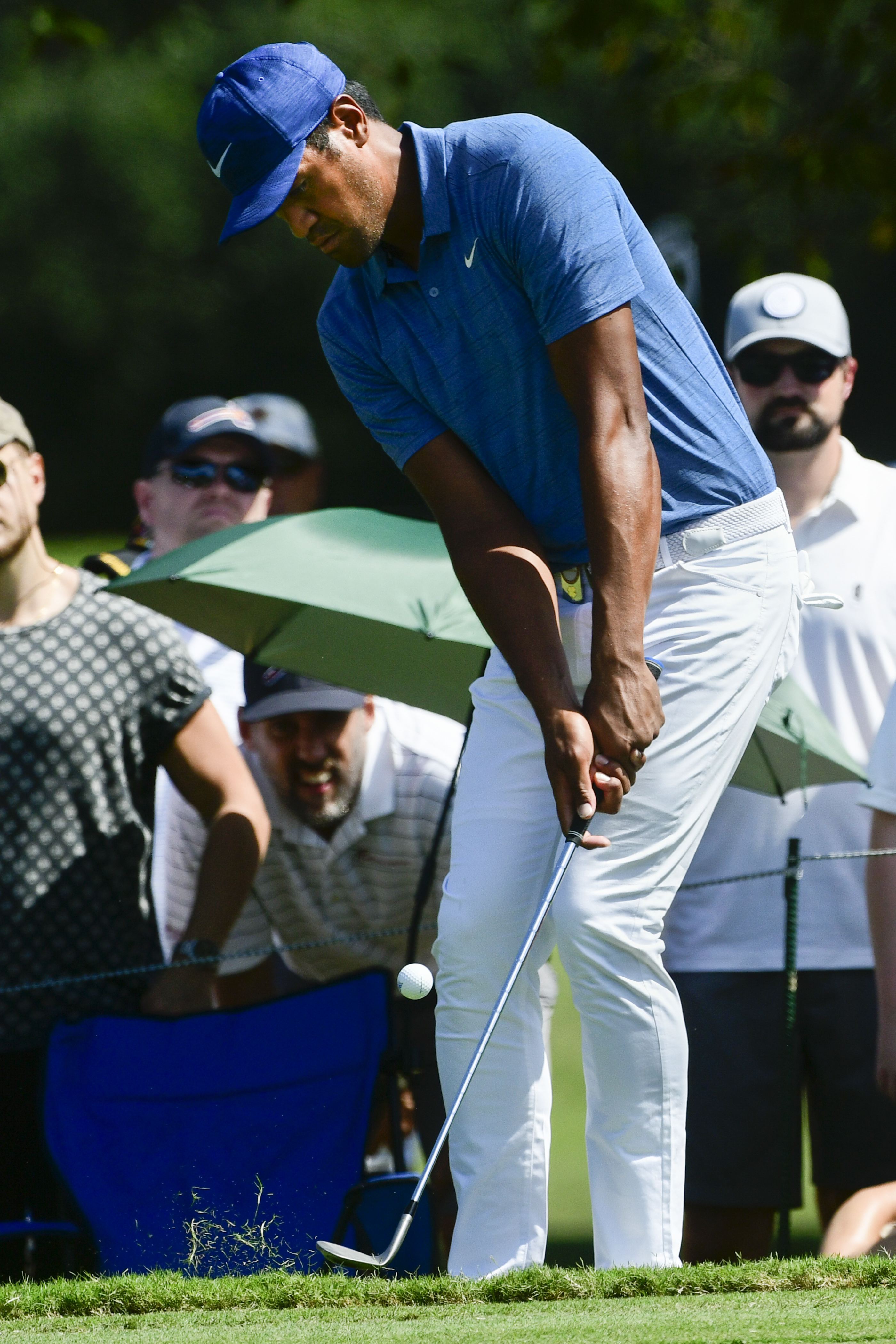 Tony Finau chips to the first green during the second round of the Tour Championship golf tournament, Friday, Sept. 21, 2018, in Atlanta. (AP Photo/John Amis)