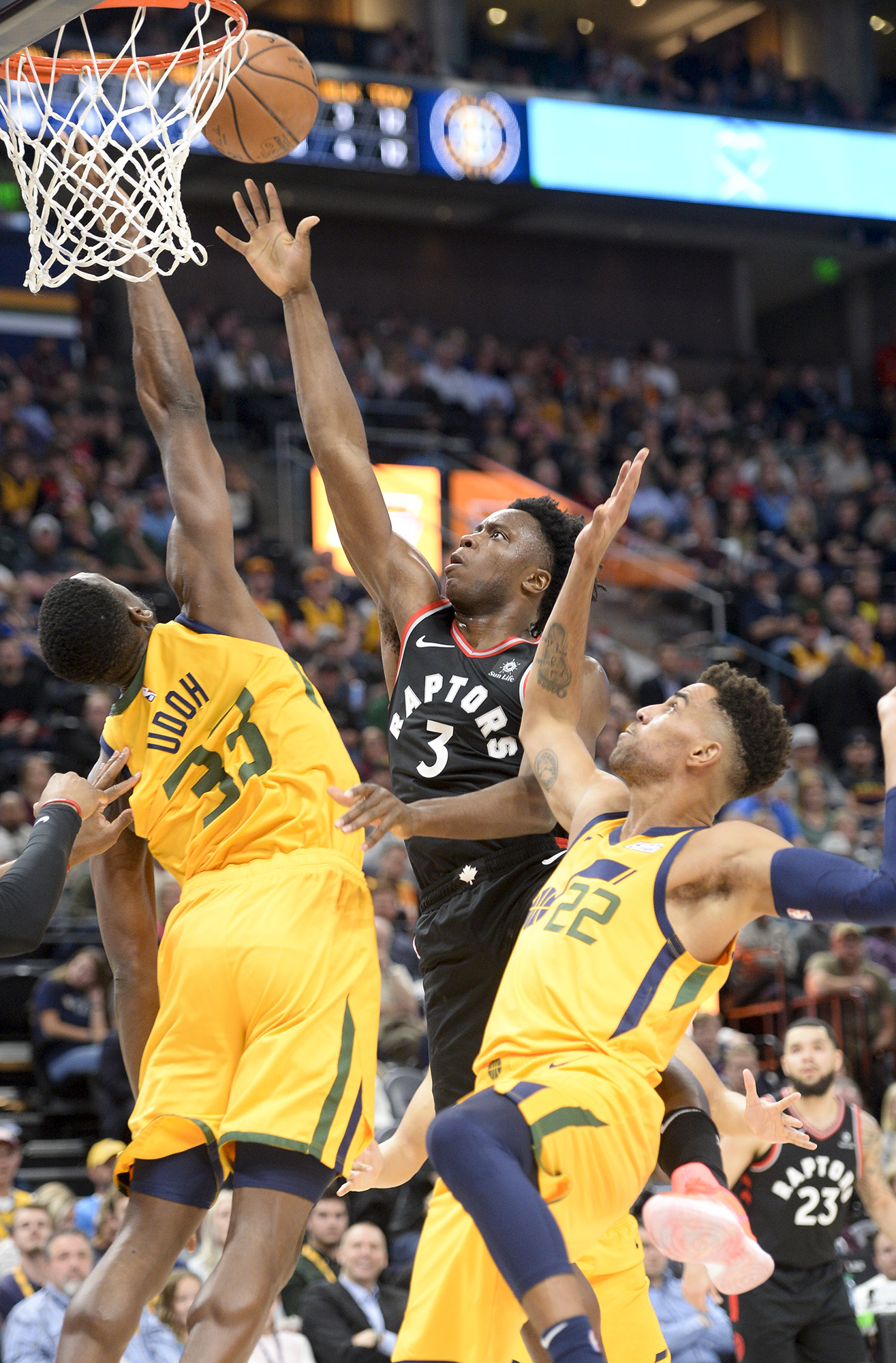 Leah Hogsten | The Salt Lake Tribune Toronto Raptors forward OG Anunoby (3) hits the net between Utah Jazz center Ekpe Udoh (33) and Utah Jazz forward Thabo Sefolosha (22) as the Utah Jazz lose to the Toronto Raptors, 111-124, Monday, Nov. 5, 2018 at Vivant Smart Home Arena.