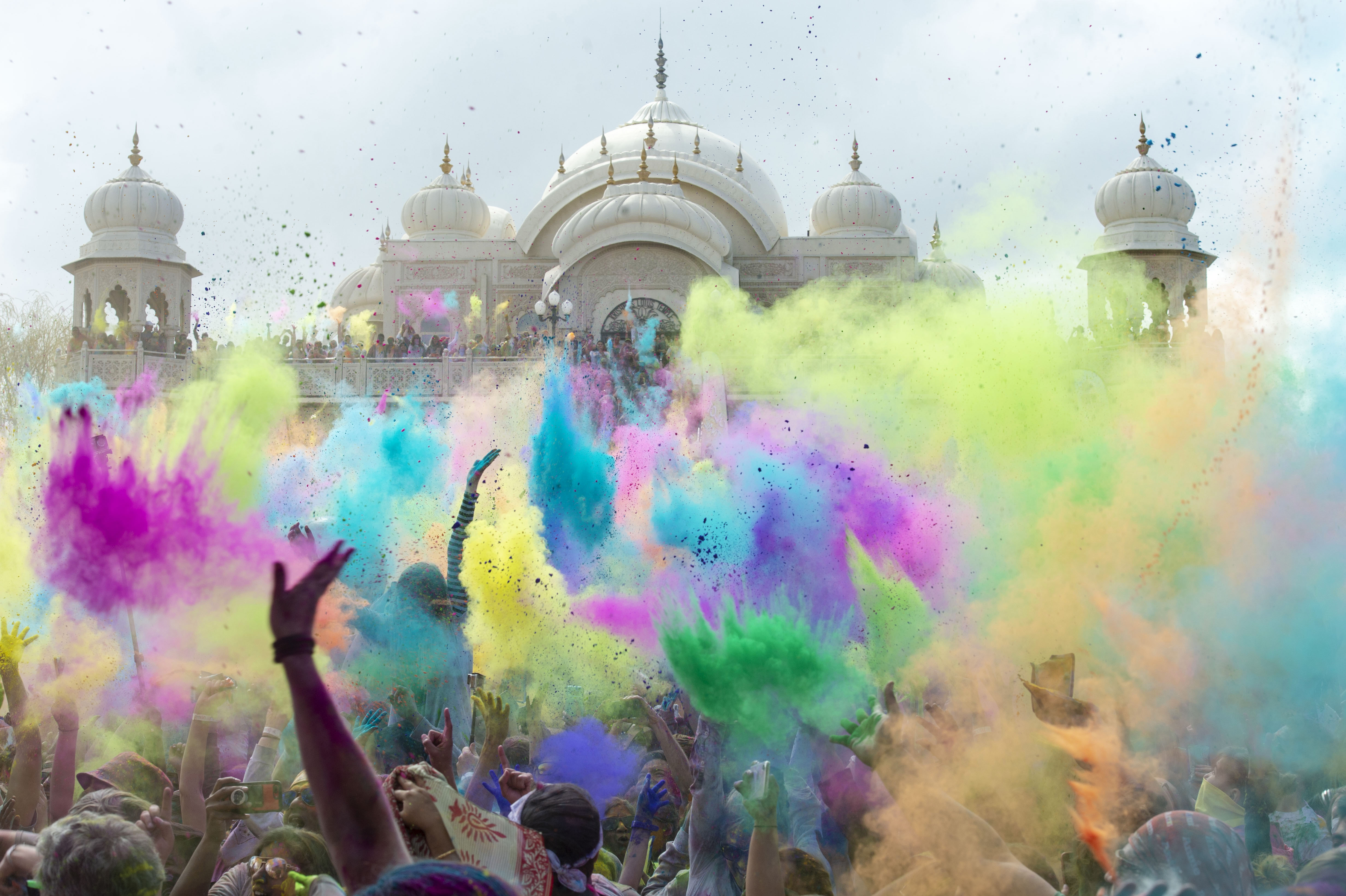 (Rick Egan | The Salt Lake Tribune) Revelers toss colored powder into the air as they celebrate the arrival of spring, during the Holi Festival of Colors celebration at the Sri Sri Radha Krishna Temple in Spanish Fork, Saturday, March 30, 2019. 