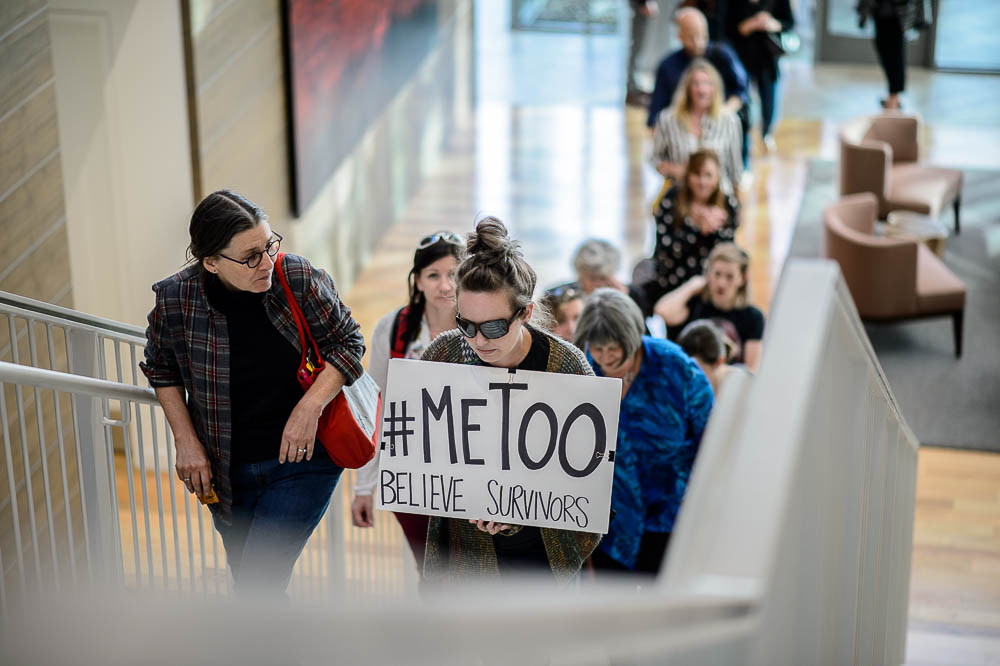 (Trent Nelson | The Salt Lake Tribune) Ashley Weitz carries a #MeToo sign as people arrive to hear Anita Hill speak at the University of Utah in Salt Lake City, Wednesday Sept. 26, 2018.