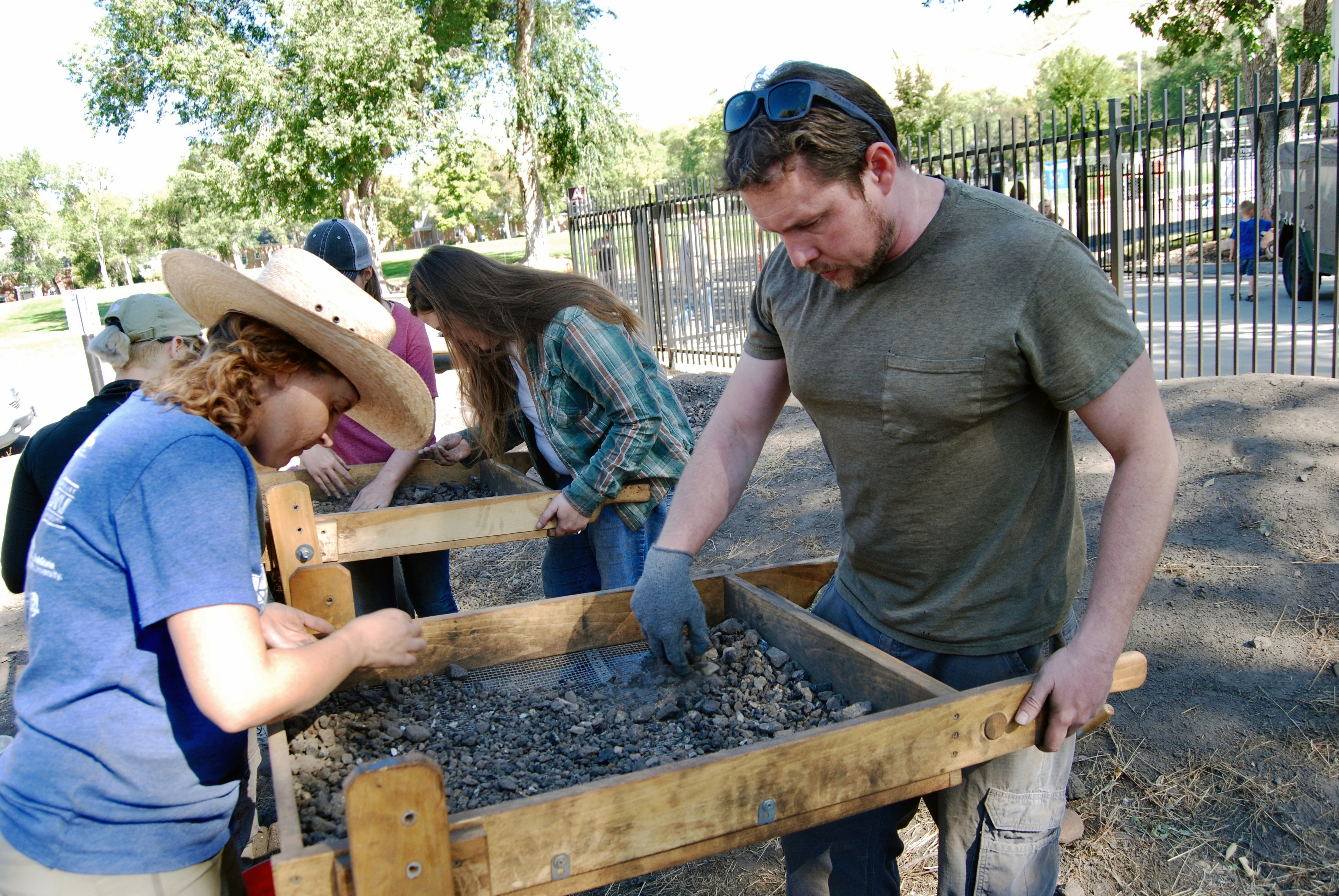 (Brian Maffly | The Salt Lake Tribune) Elizabeth Hora, left, and Skylar Schulzke examine the material left in a screen during a public archaeological event Saturday at Fort Douglas Military Museum in Salt Lake City on Saturday, Sept. 22, 2018.