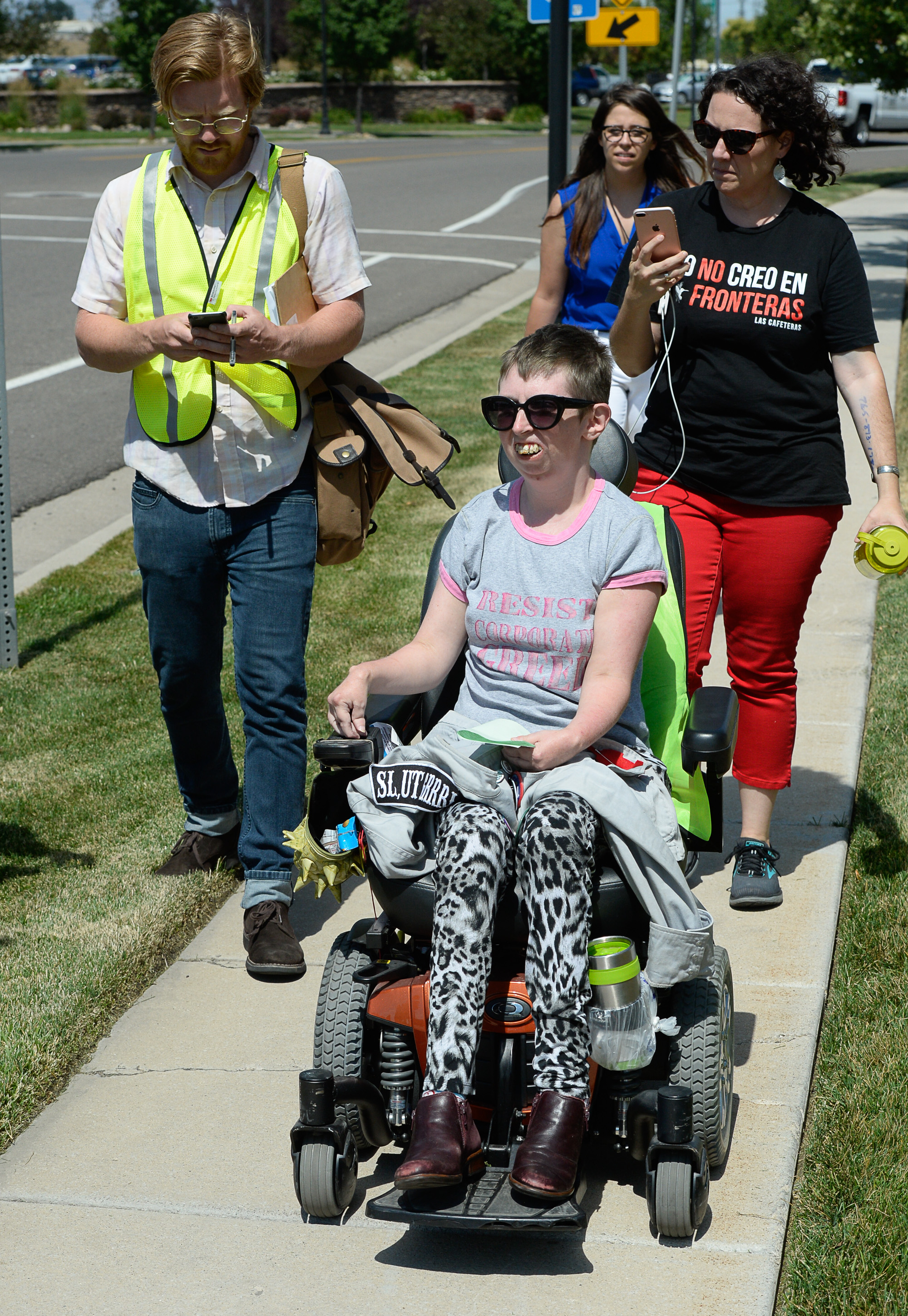 (Francisco Kjolseth | The Salt Lake Tribune) Activists Psarah Johnson talks about locking herself alongside other activists in the lobby of a private prison company with contracts to hold undocumented immigrants on Thursday, July 12, 2018, at the headquarters of Management and Training Corporation in Centerville. Johnson was released after being charged with disorderly conduct, trespassing and resisting arrest and believes she was let go while others were arrested because "the police is not ADA compliant."