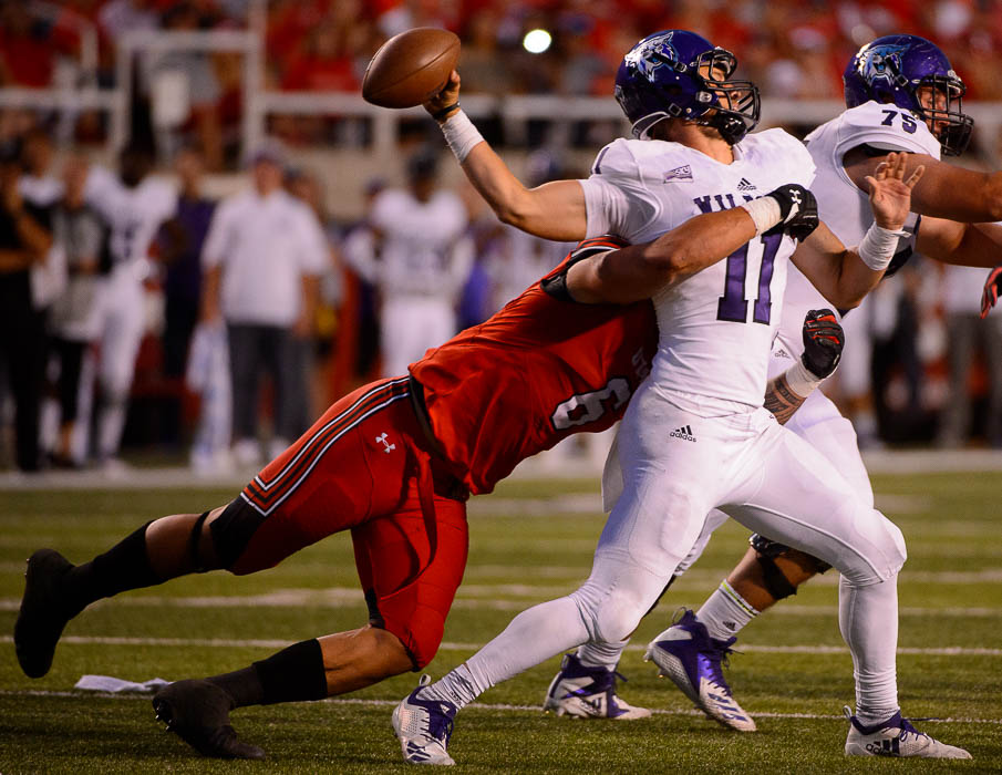 (Trent Nelson | The Salt Lake Tribune) Weber State Wildcats quarterback Kaden Jenks (11) passes as Utah Utes defensive end Bradlee Anae (6) closes in, as the University of Utah Utes host the Weber State Wildcats, Thursday Aug. 30, 2018 at Rice-Eccles Stadium in Salt Lake City.