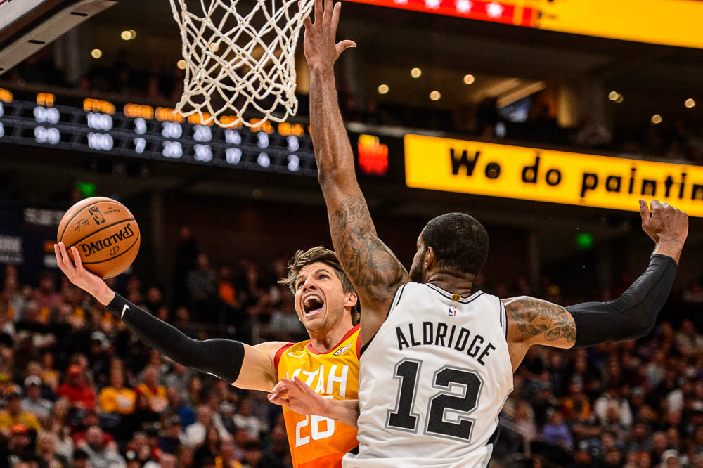 (Trent Nelson | The Salt Lake Tribune) Utah Jazz guard Kyle Korver (26) shoots around San Antonio Spurs center LaMarcus Aldridge (12) as the Utah Jazz host the San Antonio Spurs, NBA basketball in Salt Lake City on Saturday Feb. 9, 2019.
