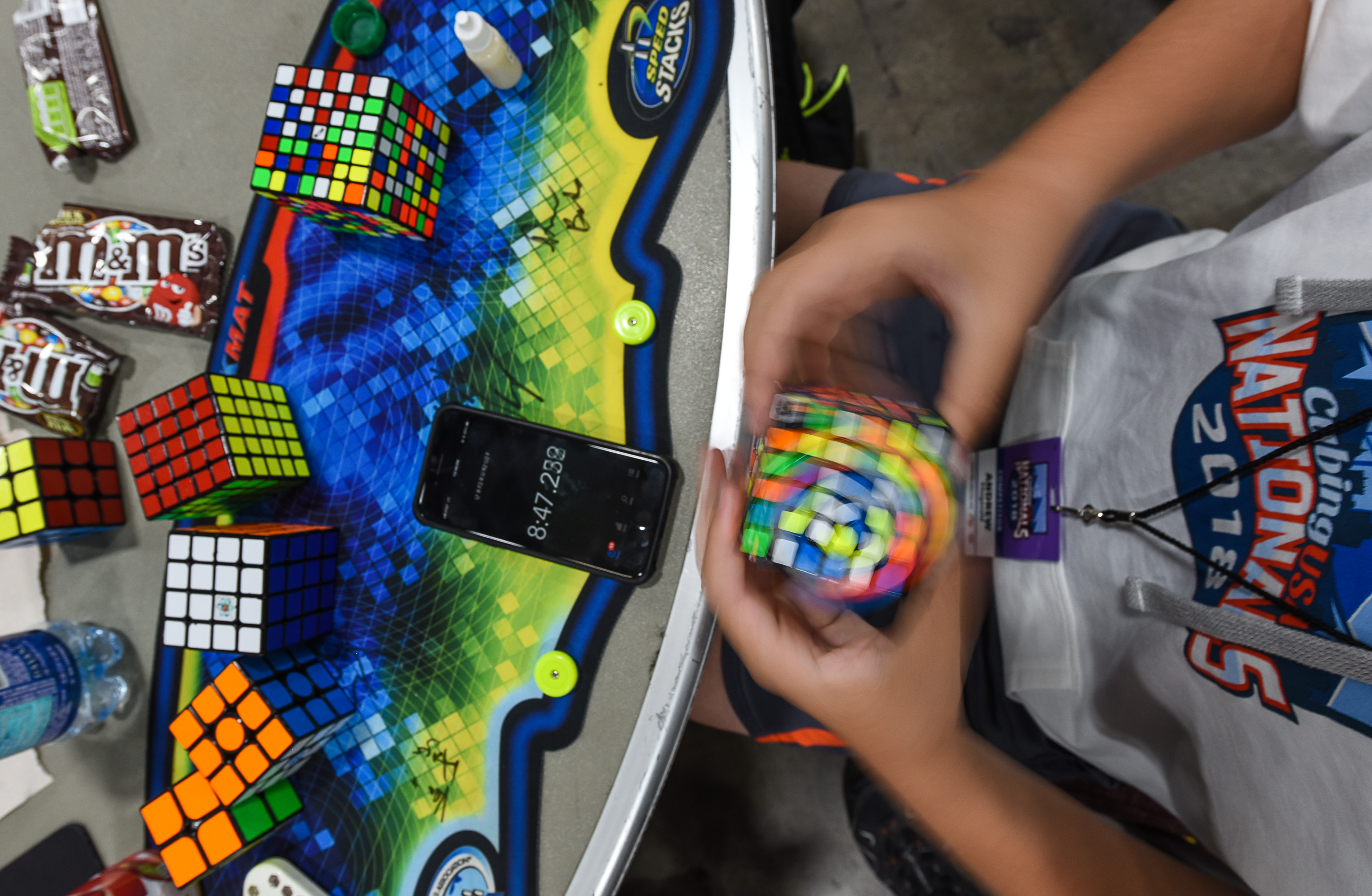 (Francisco Kjolseth | The Salt Lake Tribune) Andrew Fitzgerald, 13, of Braintree, Mass., times himself solving numerous cubes in a row as he attends CubingUSA Nationals 2018 at the Salt Palace Convention Center in Salt Lake City on Saturday, July 28, 2018.