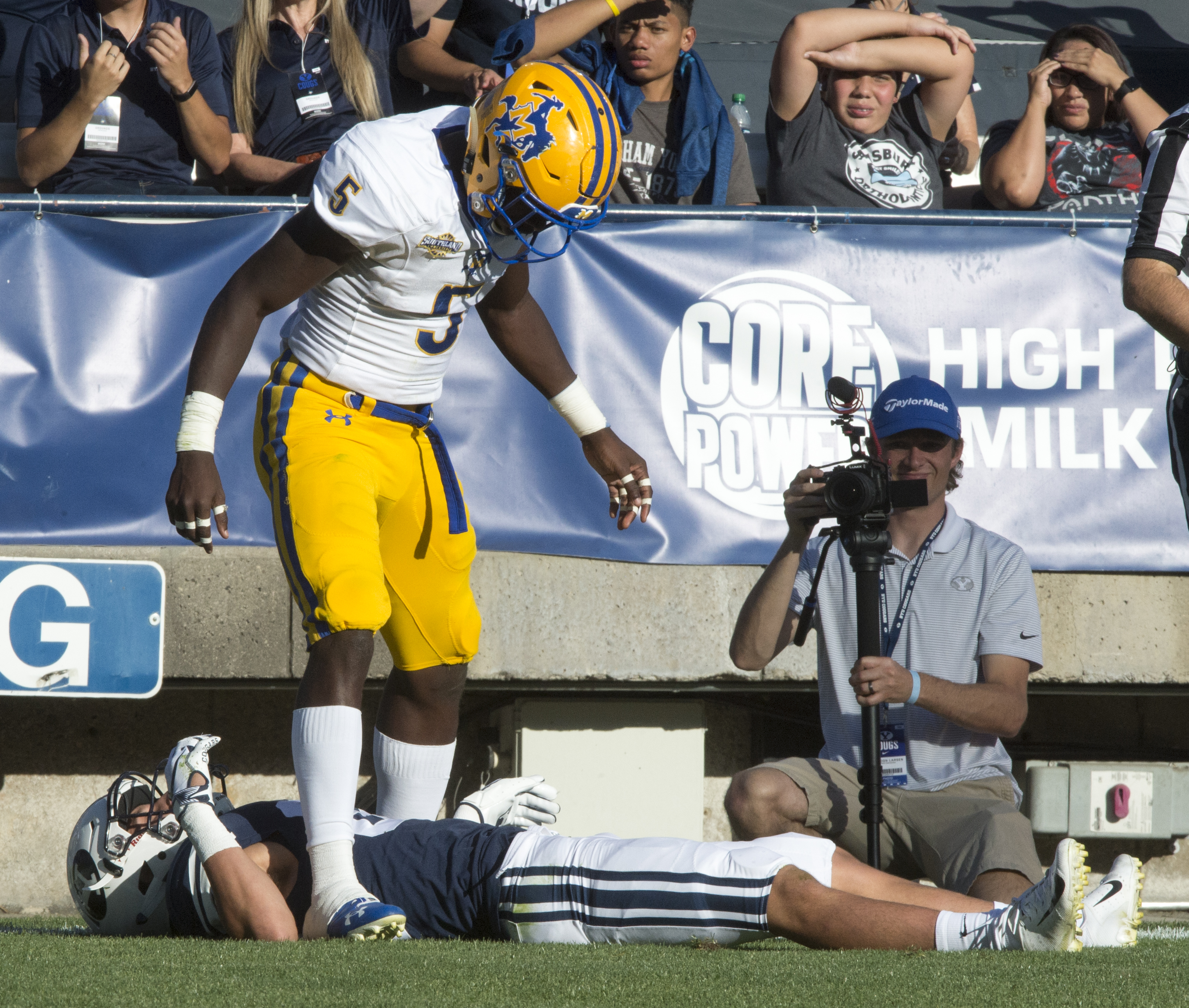 (Rick Egan | The Salt Lake Tribune) Holker (32) lies on the ground after getting hit hard by McNeese State Cowboys defensive back Jovon Burriss (5). Burris was not called for targeting after the replay, in football action Brigham Young Cougars vs McNeese State Cowboys at Lavell Edwards Stadium, Saturday, Sept. 22, 2018. 