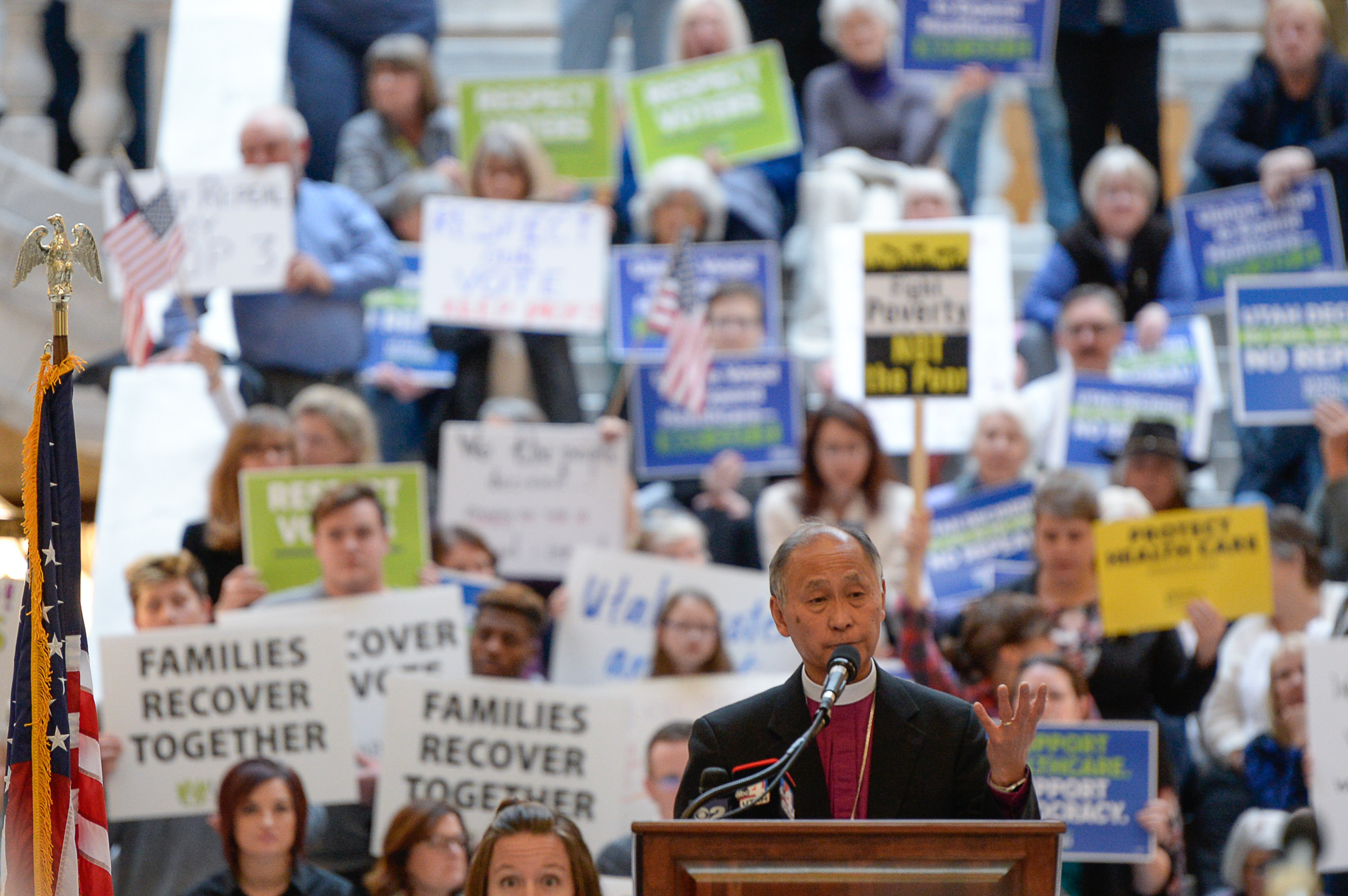 (Francisco Kjolseth | The Salt Lake Tribune) Bishop Scott Hayashi, Episcopal bishop and original sponsor of the Prop 3 initiative takes to the podium on Monday, Jan, 28, 2019, in the Capitol rotunda on the first day of the Legislative session to rally in support of protecting Proposition 3, the Medicaid Expansion law recently passed by voters.
