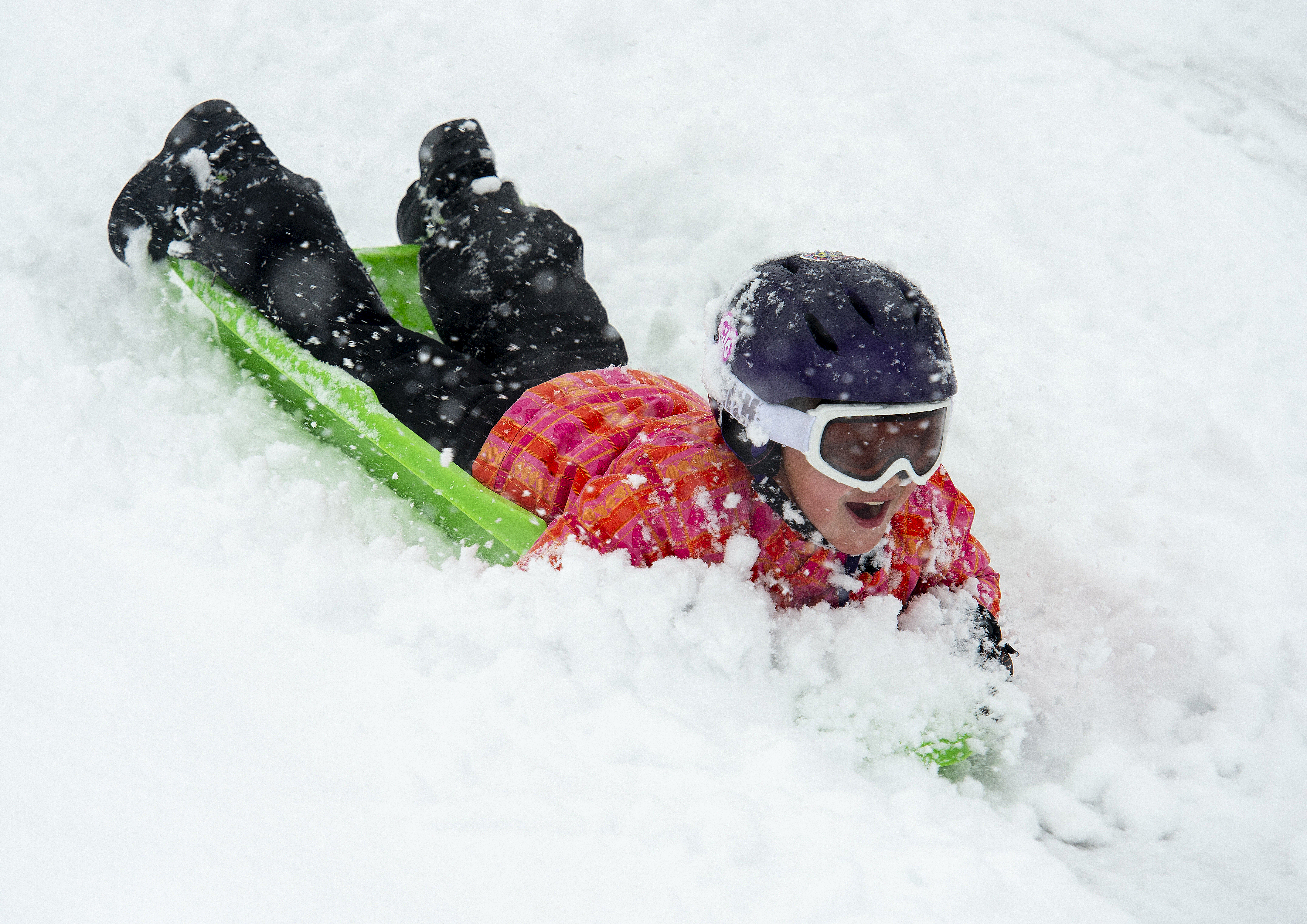 (Rick Egan | The Salt Lake Tribune) Desmond Fehlberg 7, sleds down the hill at Popperton Park, Monday, Jan. 21, 2019. 