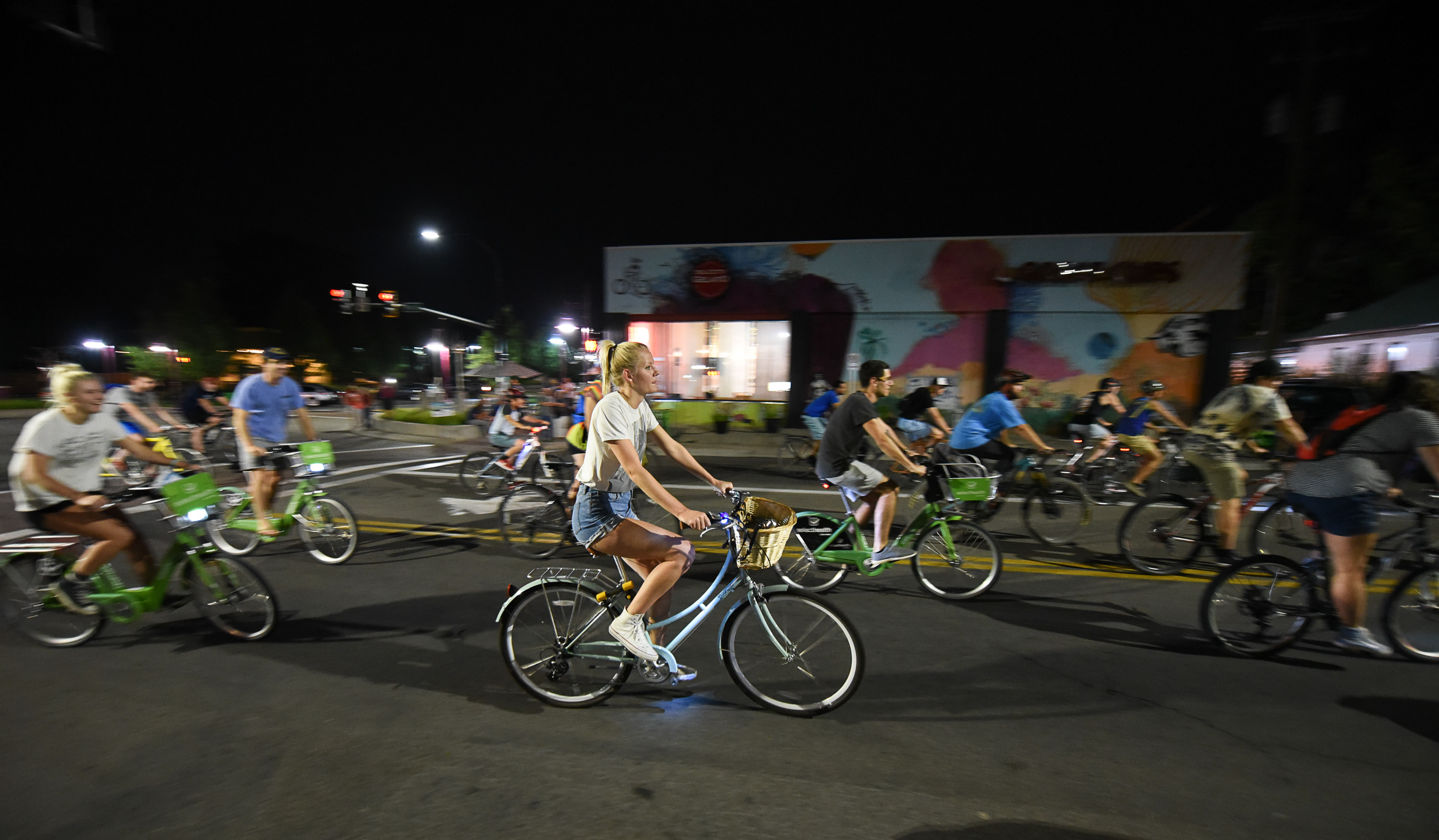 (Francisco Kjolseth | The Salt Lake Tribune) A large group of cyclist begins their ride from the corner of 9th and 9th after gathering after 9pm in Salt Lake City on Thursday, July 26, 2018, for the weekly ride that has become known as the 999 Ride. The inclusive, all-welcoming slow casual social ride happens year round on Thursday nights, with riders often pedaling into the early morning hours. Newly released video shows rider Cameron Hooyer being struck and killed by a FrontRunner train at a downtown railroad crossing during last weeks ride when the 22-year-old failed to stop or heed the warning signals before crossing the tracks during the group ride. 