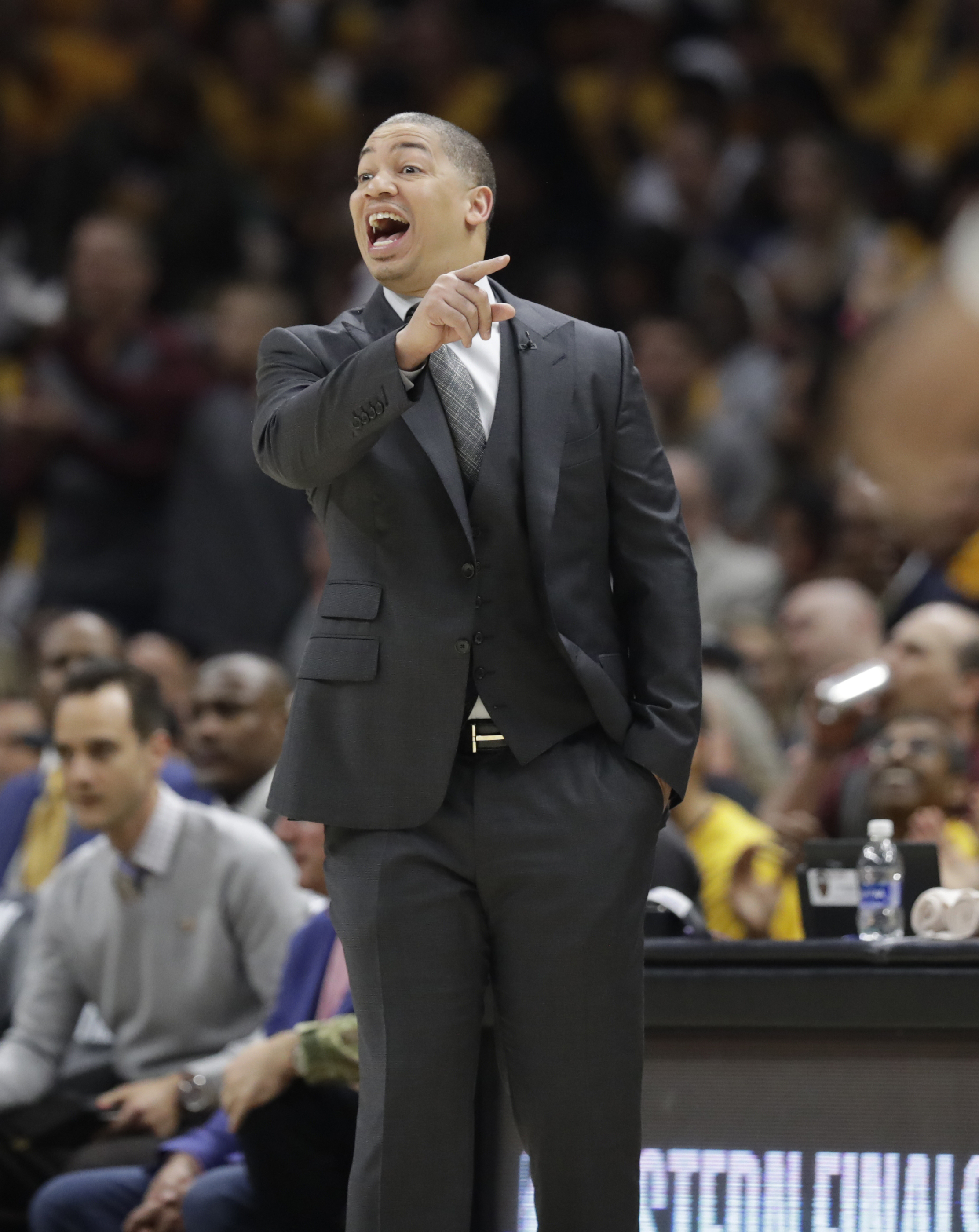 Cleveland Cavaliers head coach Tyronn Lue calls instructions against the Boston Celtics in the first half of Game 3 of the NBA basketball Eastern Conference finals, Saturday, May 19, 2018, in Cleveland. (AP Photo/Tony Dejak)