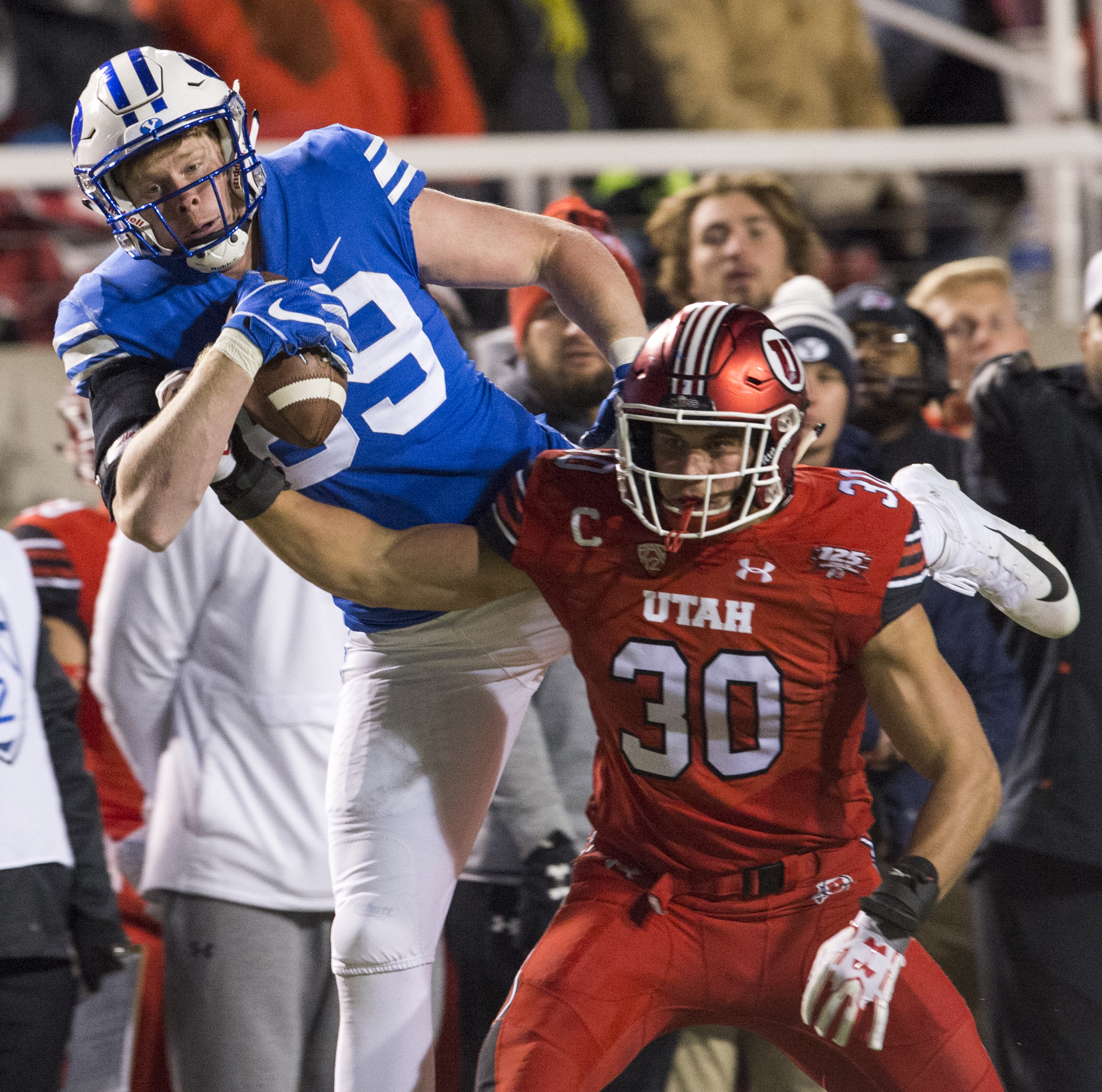 (Rick Egan | The Salt Lake Tribune) Brigham Young Cougars tight end Matt Bushman (89) grabs a one handed pass, as Utah Utes linebacker Cody Barton (30) defends, in football action between the Brigham Young Cougars and the Utah Utes, at Rice-Eccles Stadium, Saturday, November 24, 2018. 