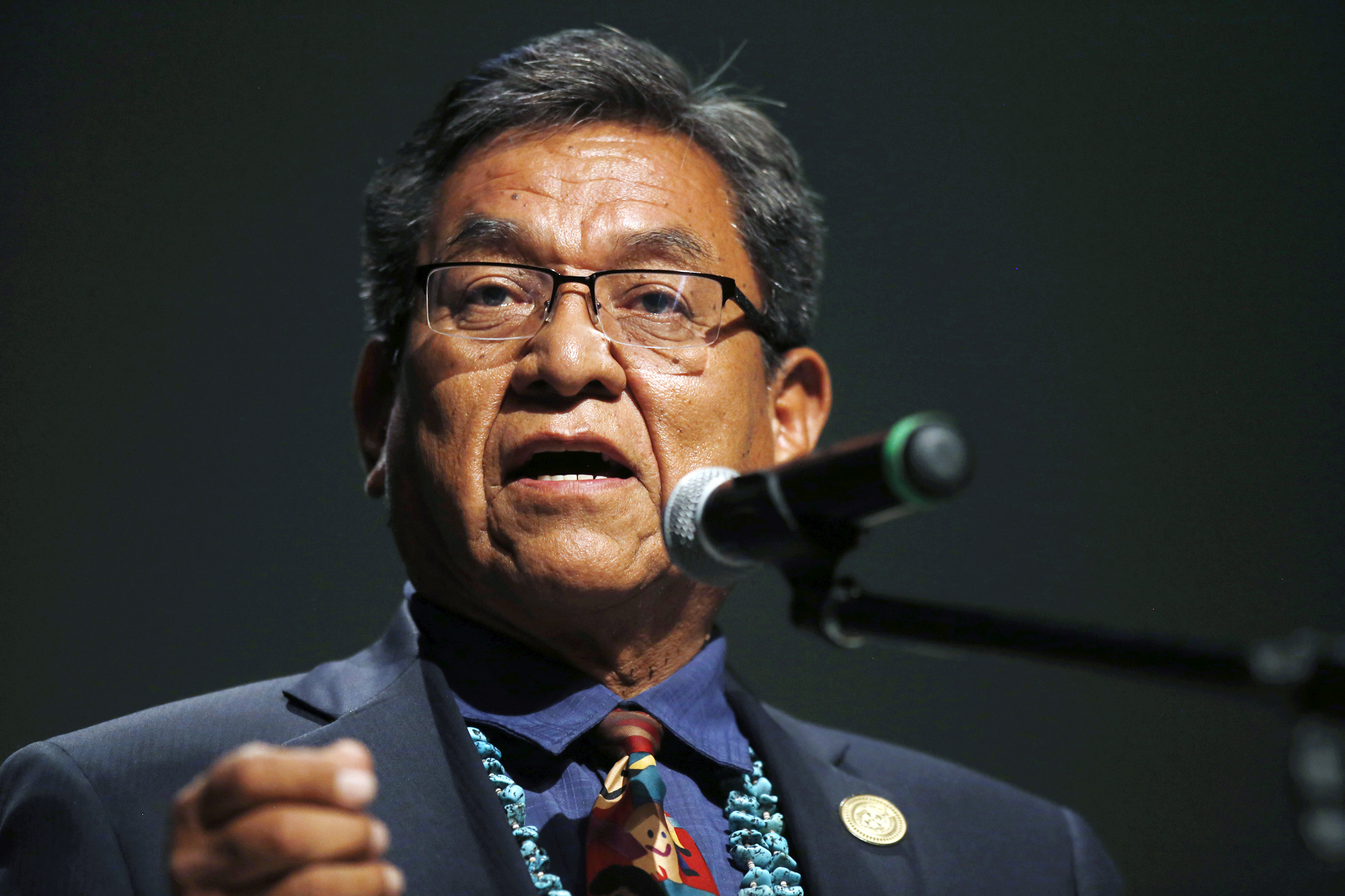 FILE - In this July 20, 2015 file photo, Navajo Nation President Russell Begaye talks with community members during a public meeting in Shiprock, N.M. The top two leaders on the Navajo Nation say recent suicides in communities affected by a mine spill have shaken reservation towns to their core. (Jon Austria/The Daily Times via AP, File) MANDATORY CREDIT