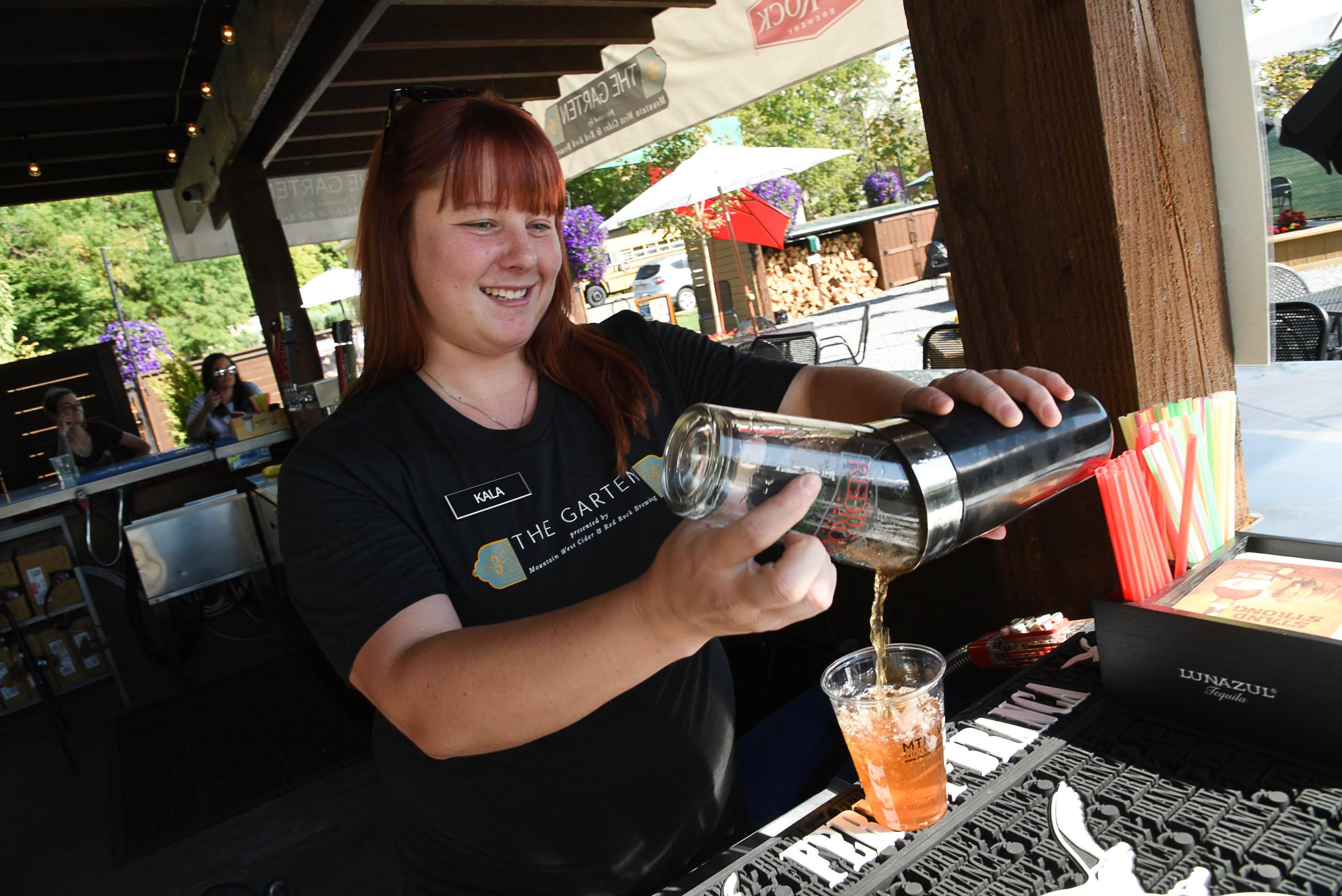 (Francisco Kjolseth | The Salt Lake Tribune) Kala Rae pours a drink at The Garten recently. Jeff and Jennifer Carleton, owners of The Garten, a new German-inspired beer garden in Salt Lake City are having a difficult time getting a permanent liquor license from the DABC. They don't qualify for a restaurant liquor license, because the venue doesnÕt have an on-site kitchen. They were denied a reception center license because they need to serve more than just offerings from food trucks. A bar license is an option, but the CarletonÕs would prefer to keep The Garten an all-ages venue, so that parents can bring their minor children. Right now they are operating on special event permits.