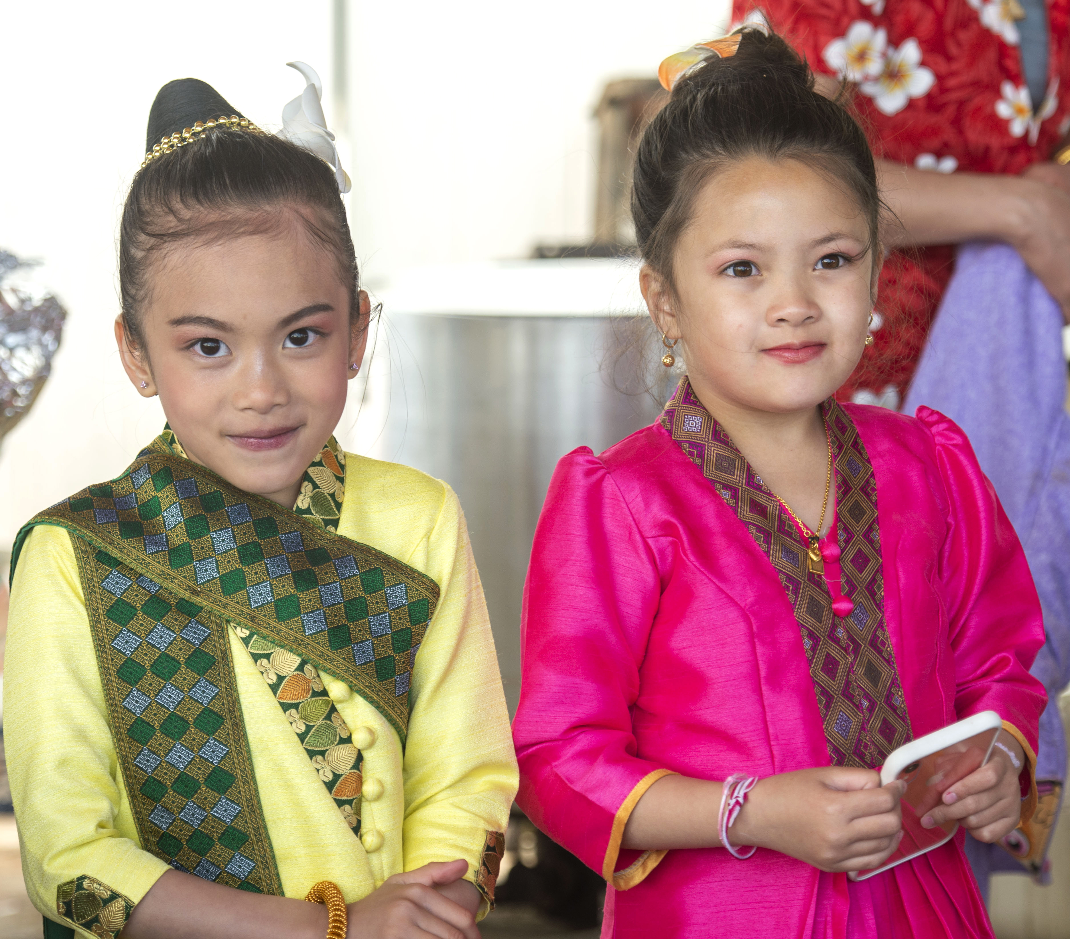 (Rick Egan | The Salt Lake Tribune) Kandra 7, and Daisee 8, wear their traditional clothes for the Wat Lao Salt Lake Buddharam Utah, New Year Celebration, in West Valley City, Sunday, April 28, 2019. 