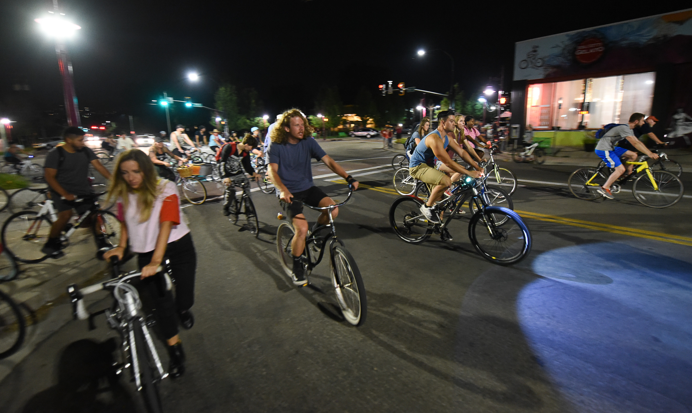 (Francisco Kjolseth | The Salt Lake Tribune) A large group of cyclist begins their ride from the corner of 9th and 9th after gathering after 9pm in Salt Lake City on Thursday, July 26, 2018, for the weekly ride that has become known as the 999 Ride. The inclusive, all-welcoming slow casual social ride happens year round on Thursday nights, with riders often pedaling into the early morning hours. Newly released video shows rider Cameron Hooyer being struck and killed by a FrontRunner train at a downtown railroad crossing during last weeks ride when the 22-year-old failed to stop or heed the warning signals before crossing the tracks during the group ride. 