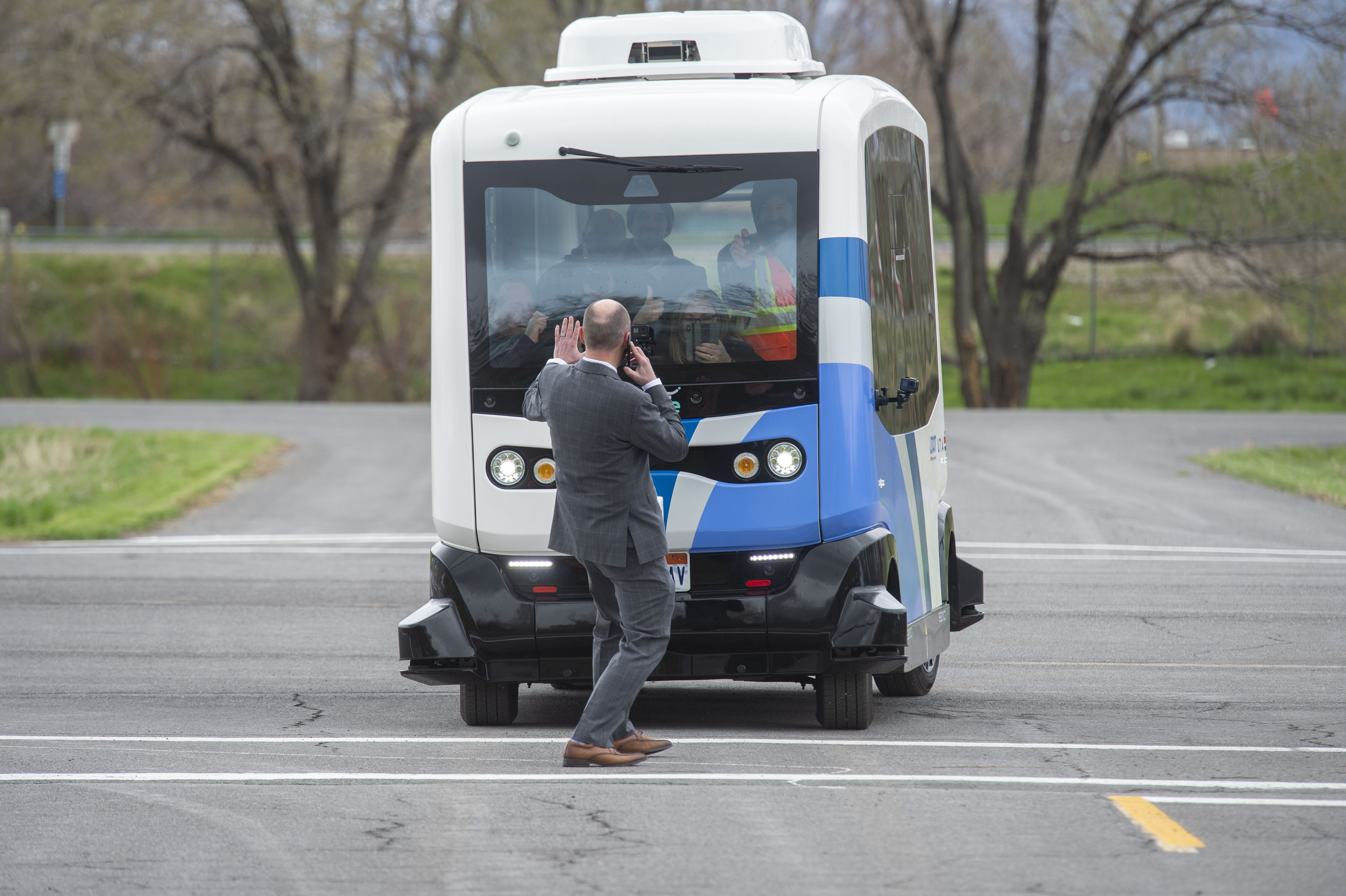 (Rick Egan | The Salt Lake Tribune) Lt. Governor Spencer J. Cox walks in front of an Autonomous Shuttle, to see if it will stop for him, during a demonstration as the Utah Department of Transportation, in partnership with the Utah Transit Authority, launched a new Autonomous Shuttle Pilot Project at the test track is across the street from UDOT headquarters on the west side of 2700 West. Thursday, April 11, 2019. 
