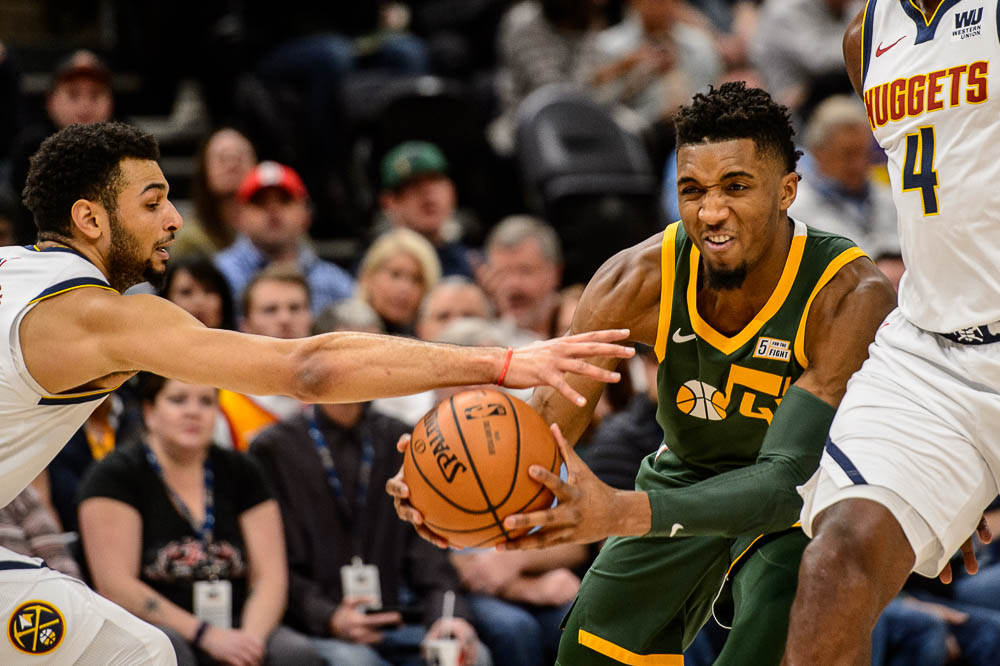 (Trent Nelson | The Salt Lake Tribune) Denver Nuggets guard Jamal Murray (27) reaches in on Utah Jazz guard Donovan Mitchell (45) as the Utah Jazz host the Denver Nuggets, NBA basketball in Salt Lake City on Wednesday Jan. 23, 2019.