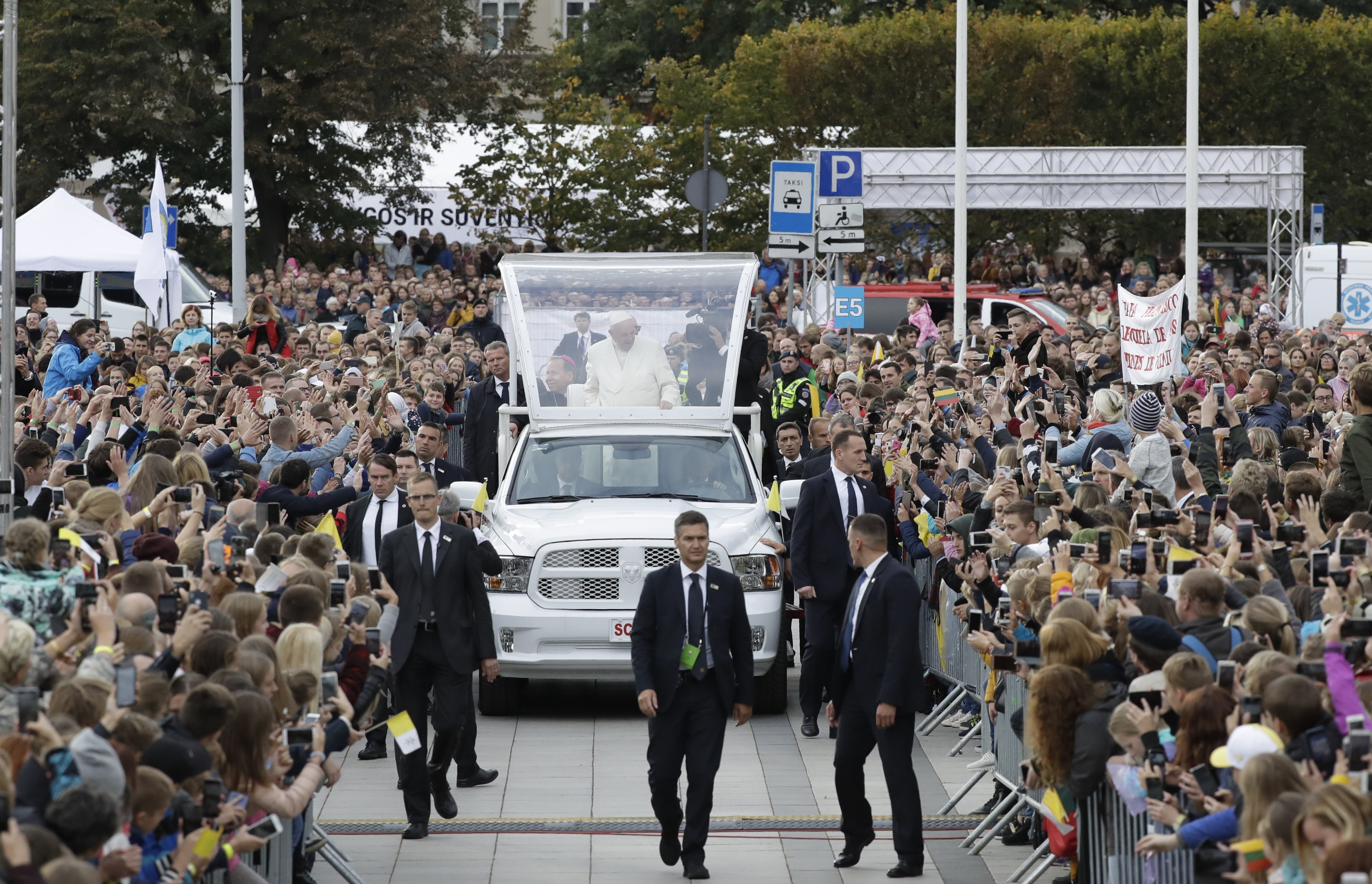 (Andrew Medichini | AP Photo) Pope Francis greets faithful as he arrives for a meeting with youths in Vilnius, Lithuania, Saturday, Sept. 22, 2018. Pope Francis begins a four-day visit to the Baltics amid renewed alarm about Moscow's intentions in the region it has twice occupied.
