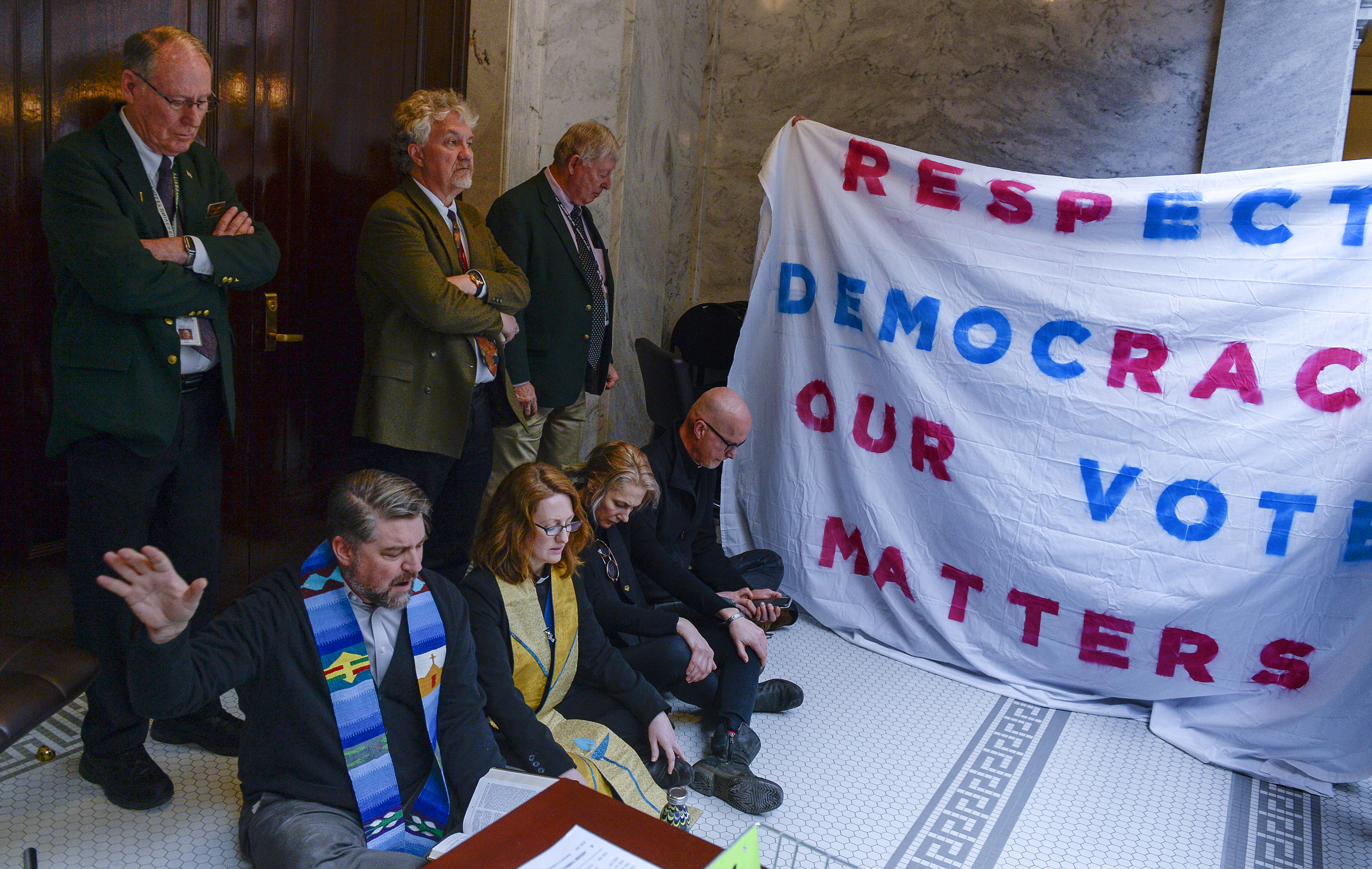 Leah Hogsten | The Salt Lake Tribune Faith leaders l-r Rev. Curtis Price with The First Baptist Church of Salt Lake City, Rev. Monica Dobbins with the First Unitarian Church of Salt Lake City, Zen Buddhist Anna Zumwalt and Pastor David Nichols with Mt. Tabor Lutheran Church demonstrate in opposition to SB96 outside the Utah House chambers, Feb. 8, 2019. 