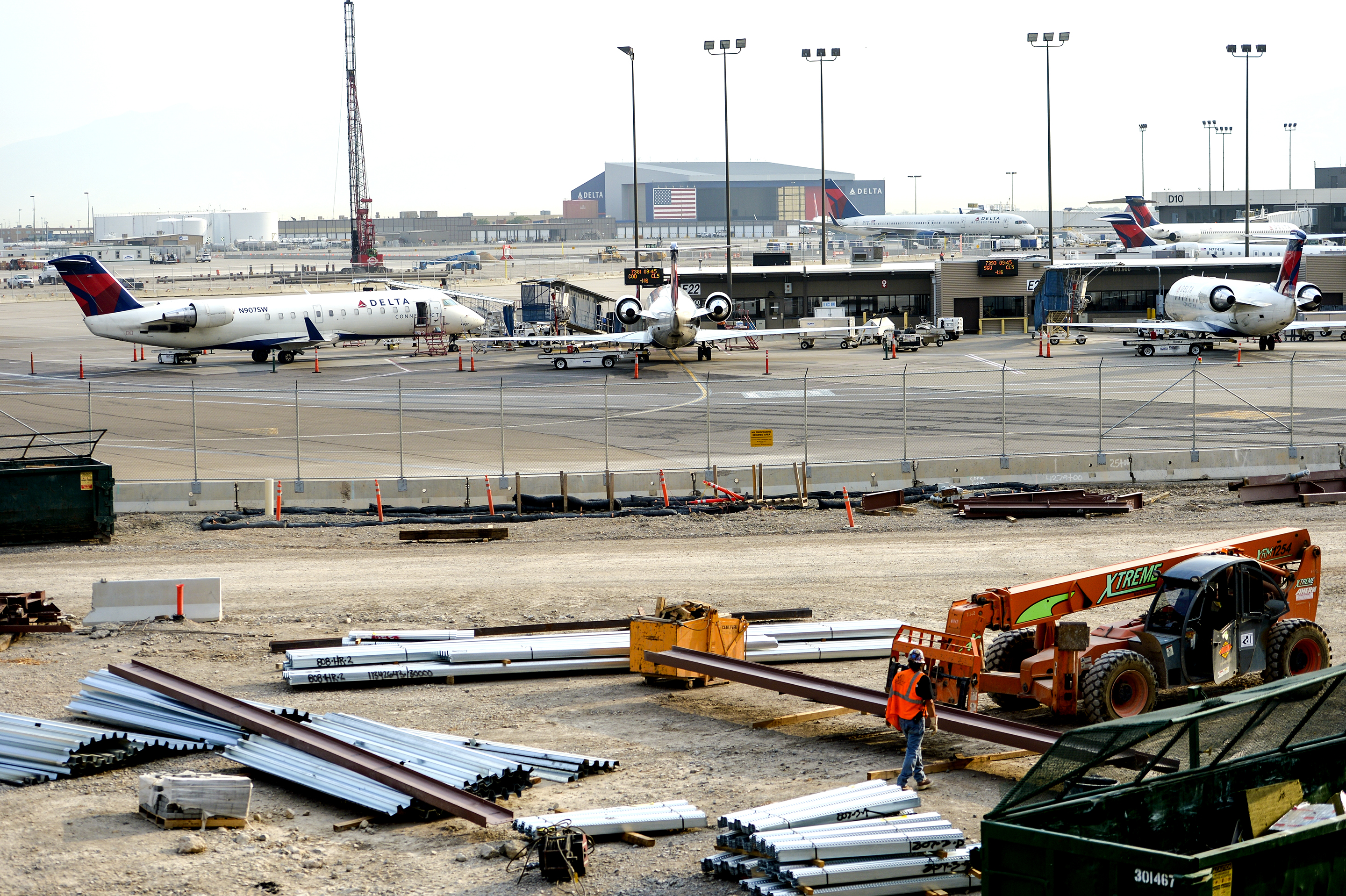 Leah Hogsten | The Salt Lake Tribune Salt Lake City International Airport's first phase construction of the $3.6 billion project is hitting the halfway mark Ñ and large new buildings and elevated roadways are more easily seen. Nearing completion is the new concourse for aircraft gates, an enclosed new terminal, the steel skeleton of a new ÒgatewayÓ building, a new five-story parking garage and elevated roadways. 