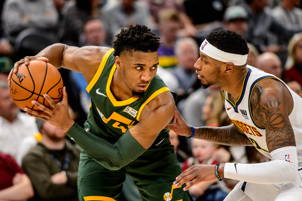 (Trent Nelson | The Salt Lake Tribune) Utah Jazz guard Donovan Mitchell (45) defended by Denver Nuggets forward Torrey Craig (3) as the Utah Jazz host the Denver Nuggets, NBA basketball in Salt Lake City on Wednesday Jan. 23, 2019.