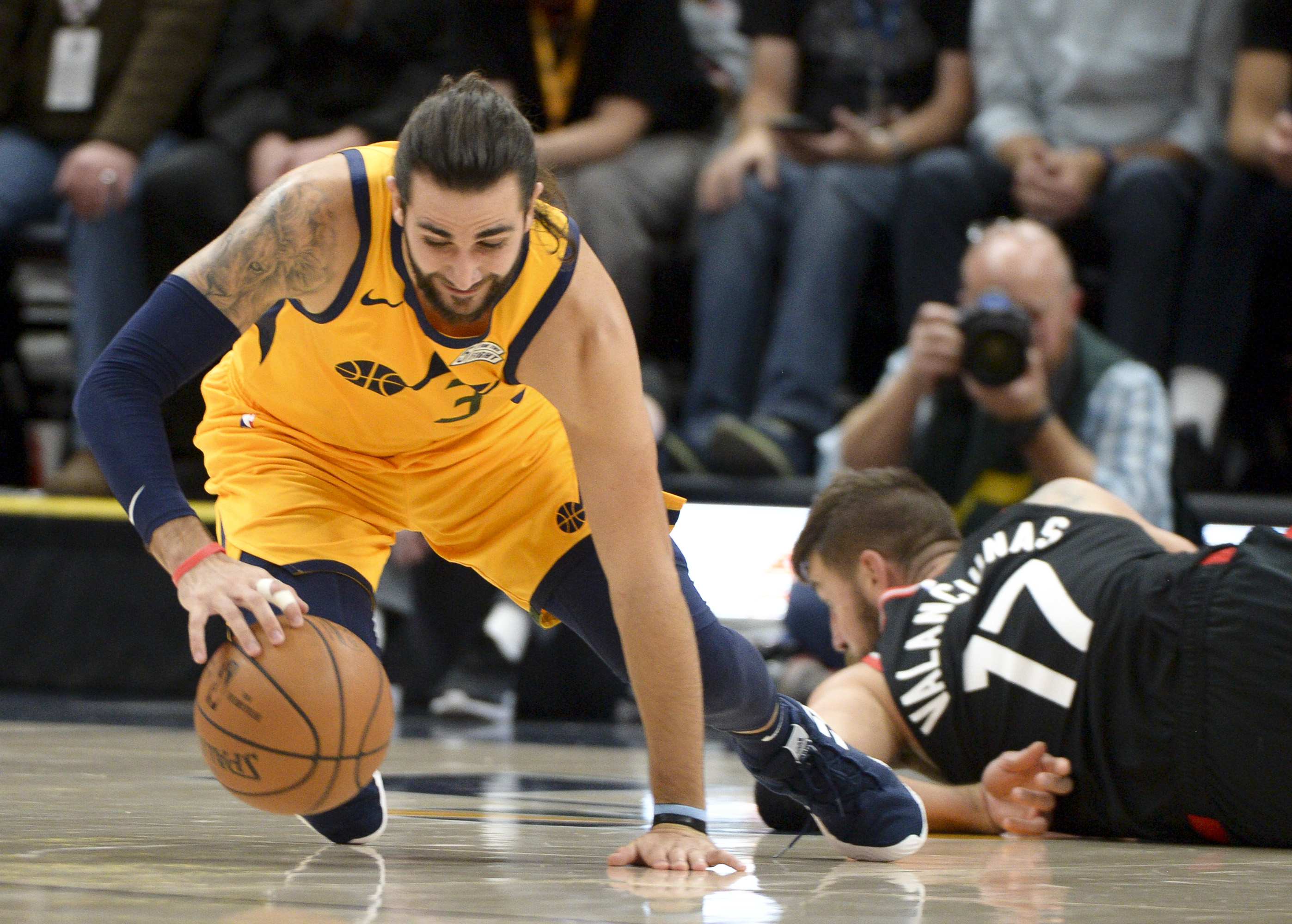 Leah Hogsten | The Salt Lake Tribune Utah Jazz guard Ricky Rubio (3) hits the deck with Toronto Raptors center Jonas Valanciunas (17) trying to get the rebound as the Utah Jazz host the Toronto Raptors, Monday, Nov. 5, 2018 at Vivant Smart Home Arena.