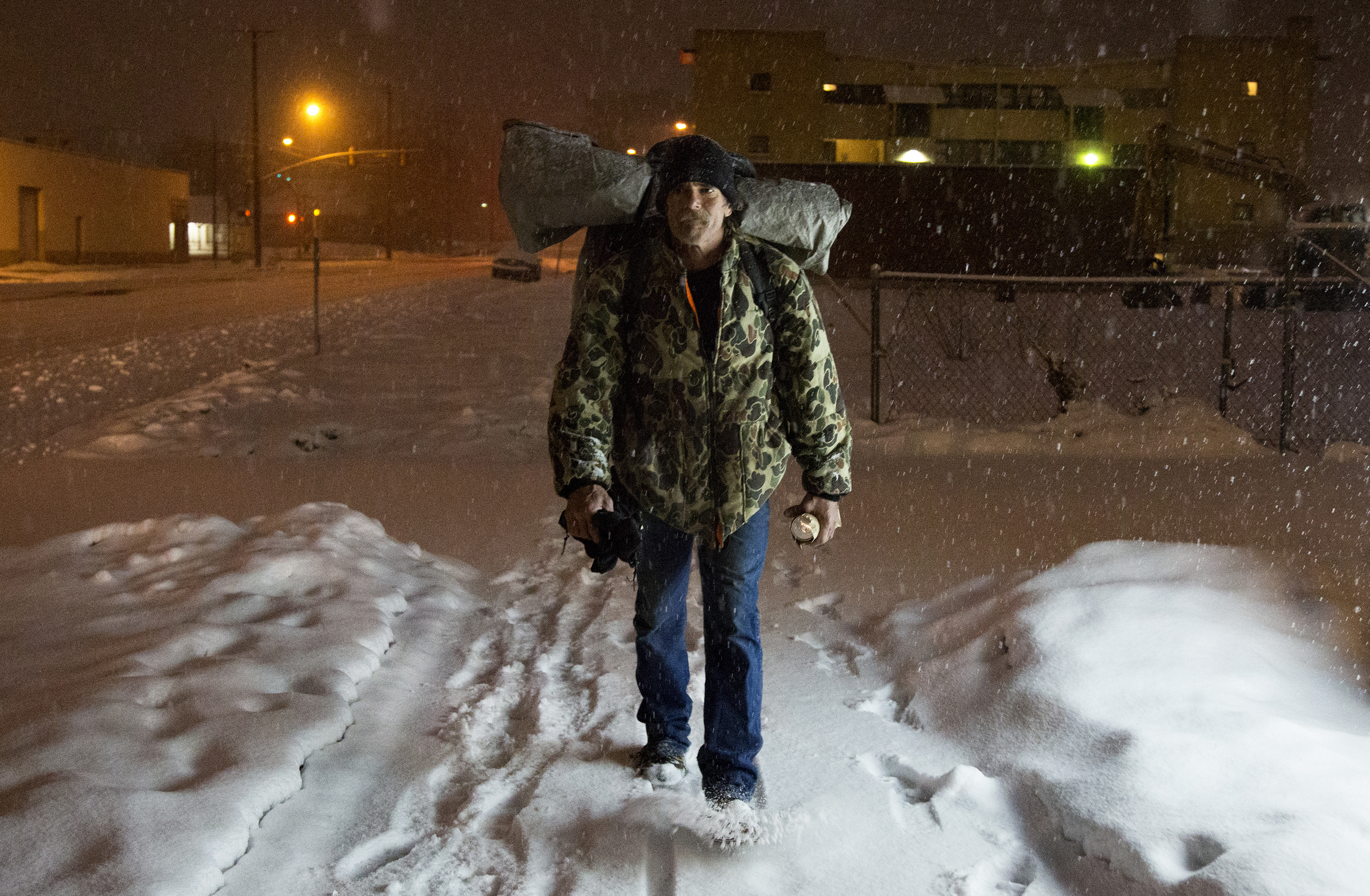 Doug "Boy Scout" Harding, a self-described "retired hobo" heads to Marshall White Park after picking up an early morning beer on Friday, Jan. 15, 2016. At the time, Harding was homeless, but in the final stages of finding an apartment. Harding had been homeless for around 30 years before finding housing through the Weber Housing Authority. (Benjamin Zack/Standard-Examiner via AP)