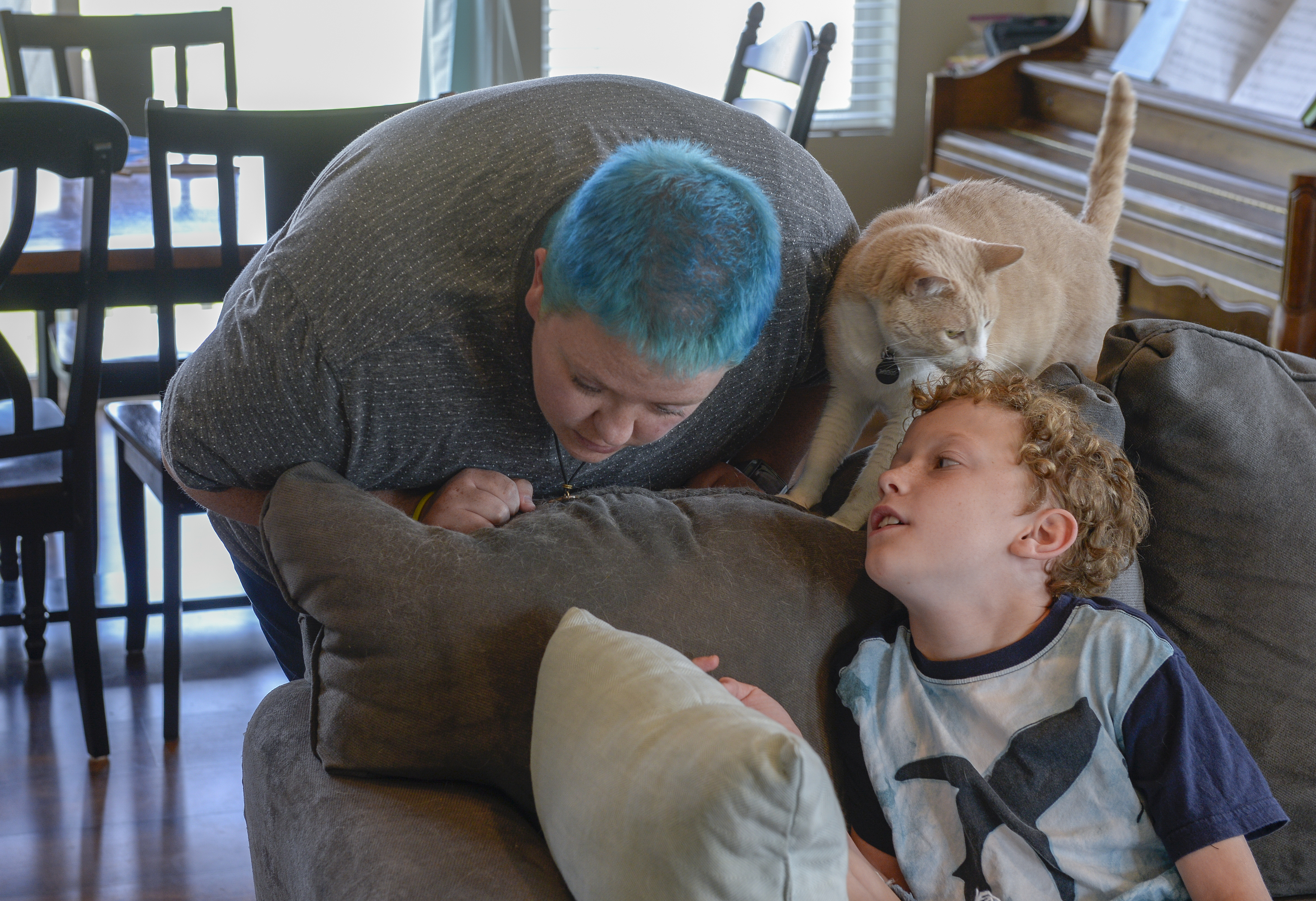 (Leah Hogsten | The Salt Lake Tribune) Kris Irvin leans into their son as Toby whispers a question. After a lifetime of feeling like they were born into the wrong body, Kris Irvin came out as transgender three years ago at the age of 28.