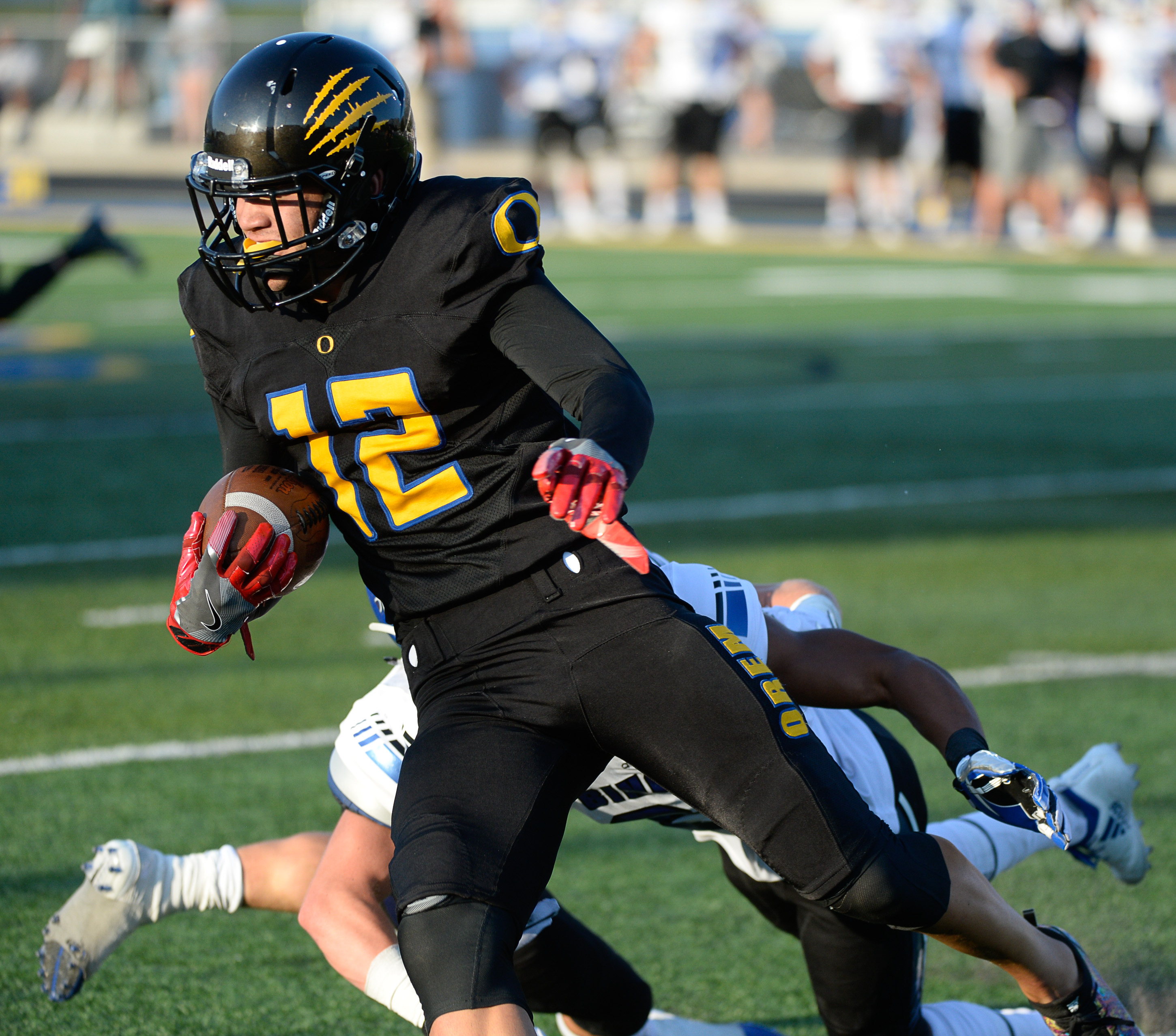 (Francisco Kjolseth | The Salt Lake Tribune) Orem's Puka Nacua slips past the Bingham defense during the first half of the season's start Thursday, Aug. 16, 2018 in Orem.