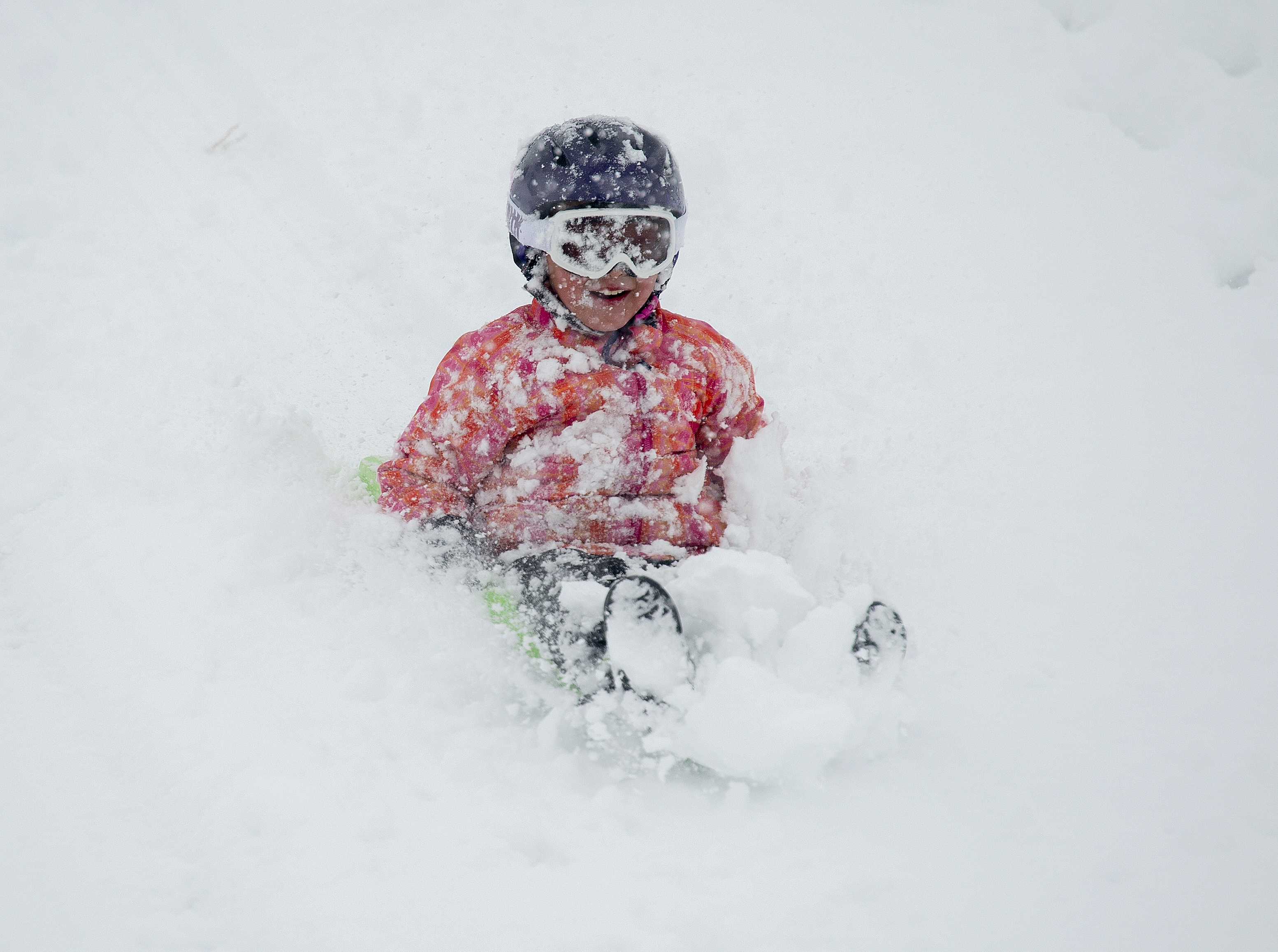 (Rick Egan | The Salt Lake Tribune) Desmond Fehlberg 7, sleds down the hill at Popperton Park, Monday, Jan. 21, 2019. 