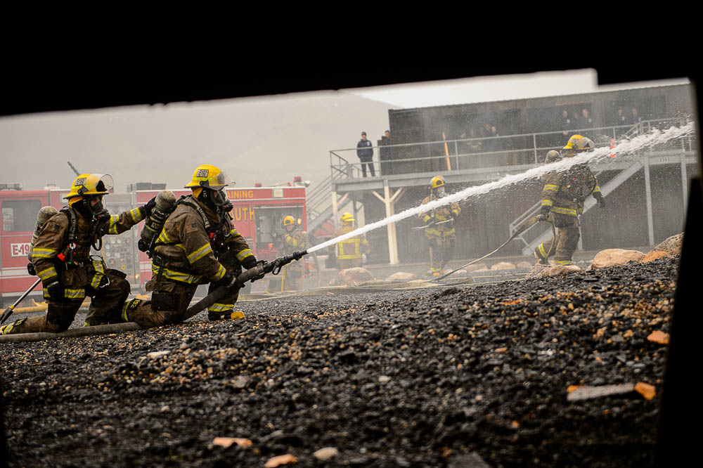 (Trent Nelson | The Salt Lake Tribune) Unified Fire recruits in a live response to a vehicle and structure fire at the Unified Fire Authority Training Center in Magna on Tuesday April 16, 2019.