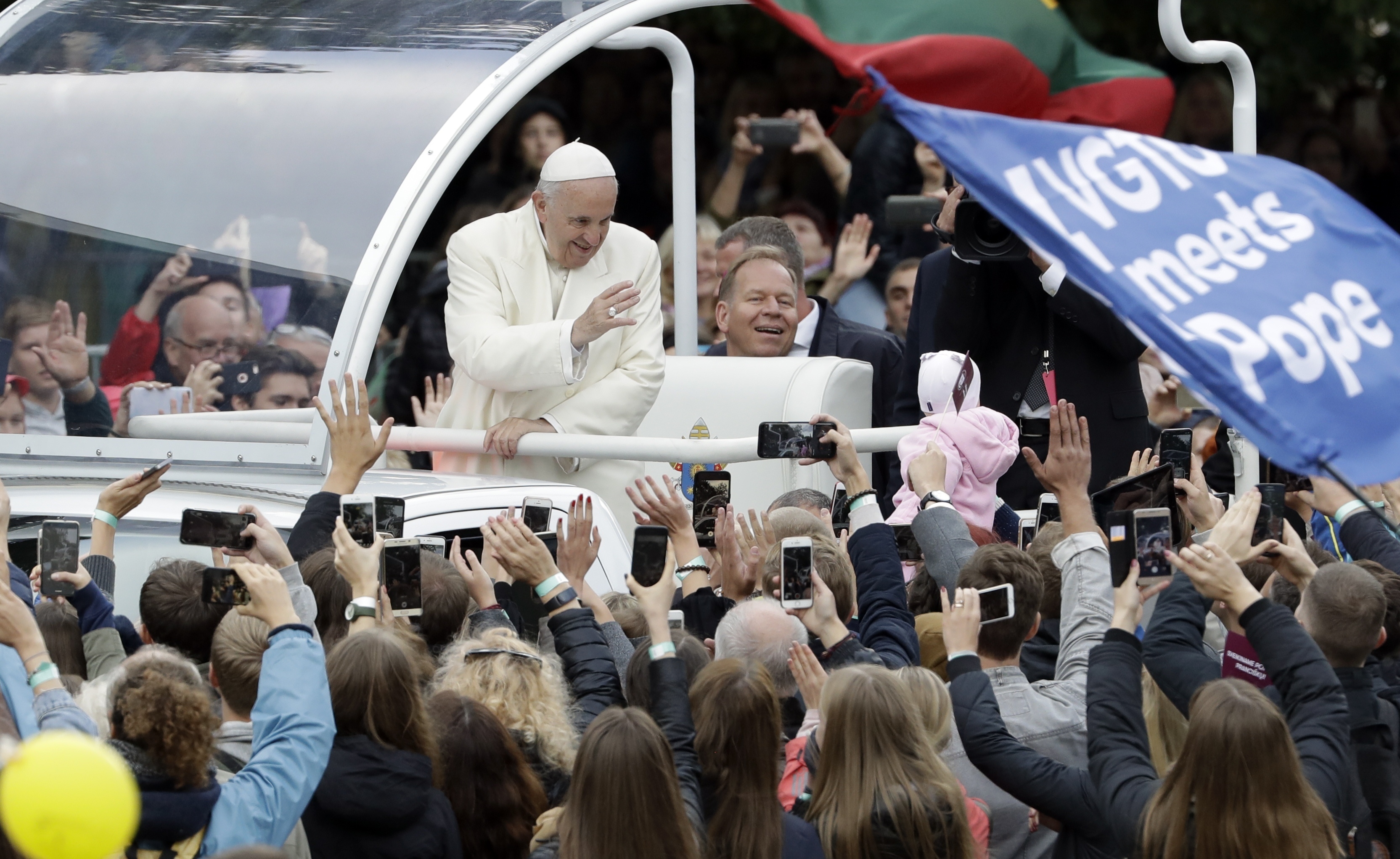 (Andrew Medichini | AP Photo) Pope Francis greets faithful as he arrives for a meeting with youths in Vilnius, Lithuania, Saturday, Sept. 22, 2018. Pope Francis begins a four-day visit to the Baltics amid renewed alarm about Moscow's intentions in the region it has twice occupied.